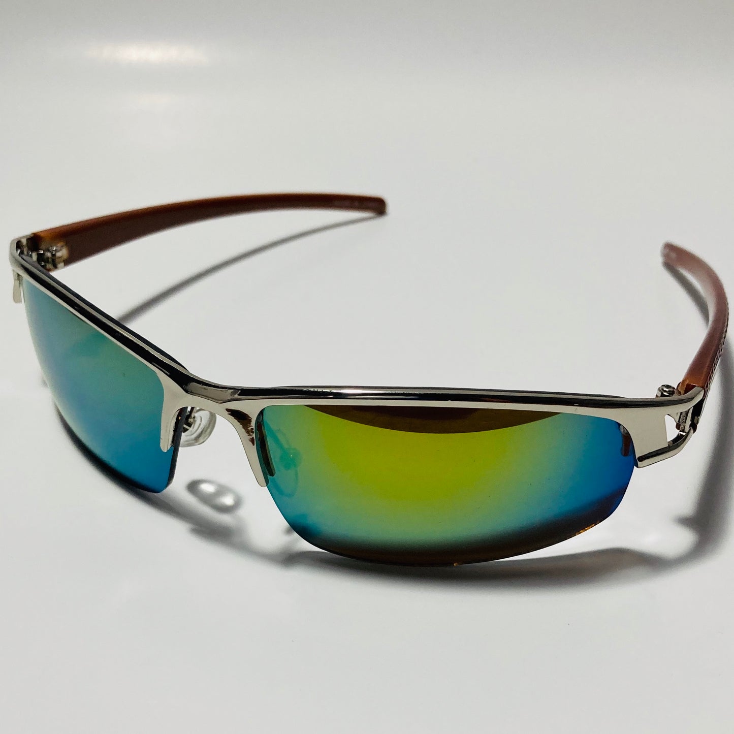 womens and mens silver wrap around sunglasses with mirrored green lenses