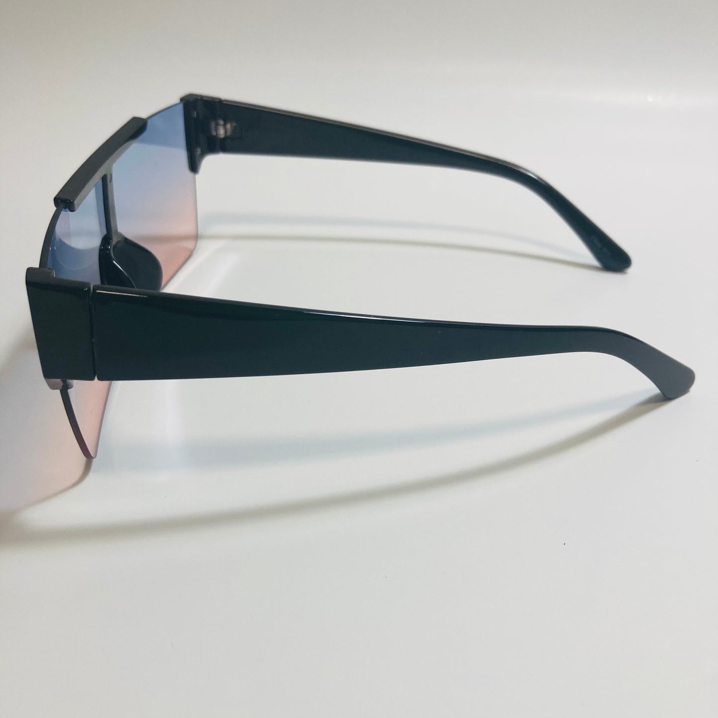 womens and mens blue and pink half rim square sunglasses