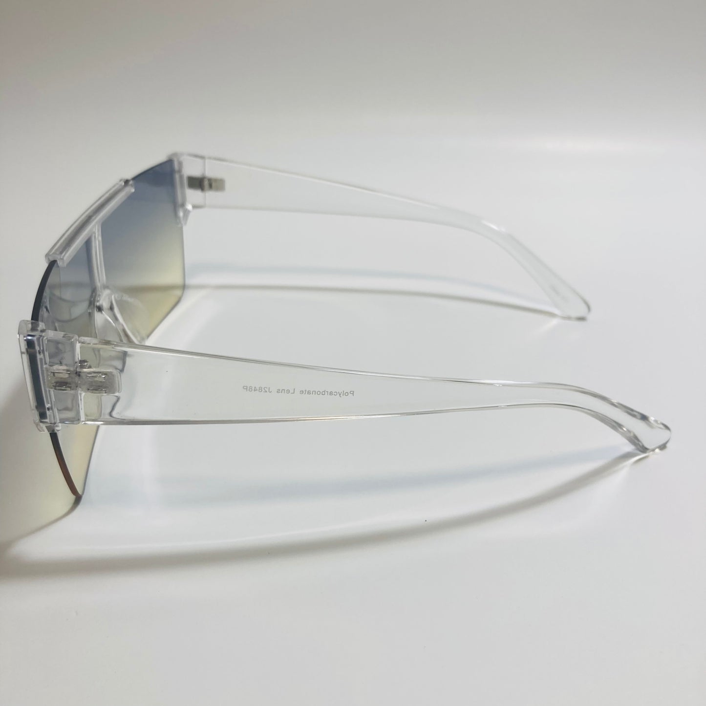 womens and mens clear and blue half rim square sunglasses