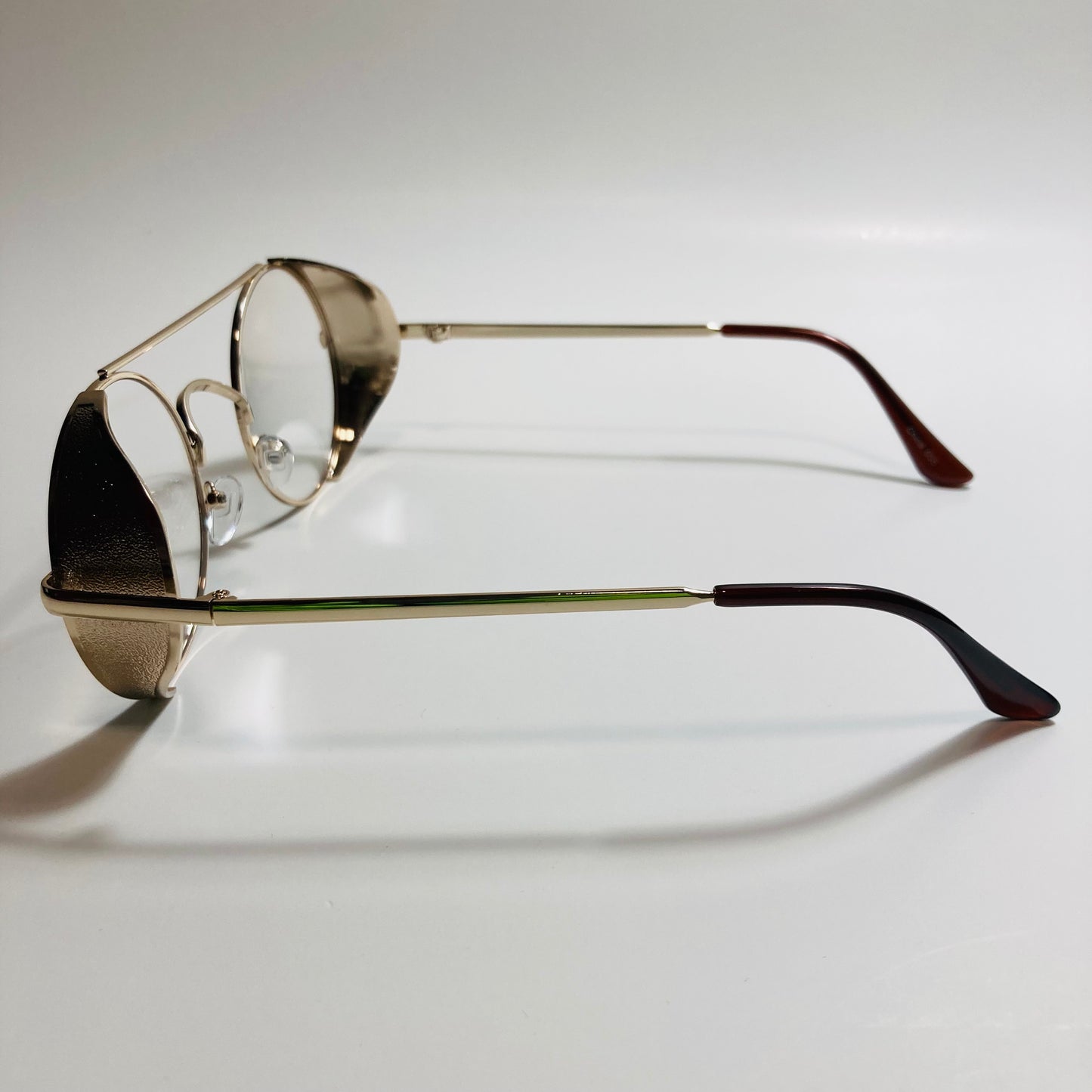 mens and womens white gold round glasses with side shields