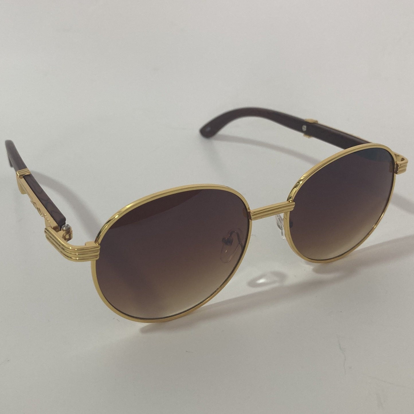 womens and mens gold and brown round sunglasses