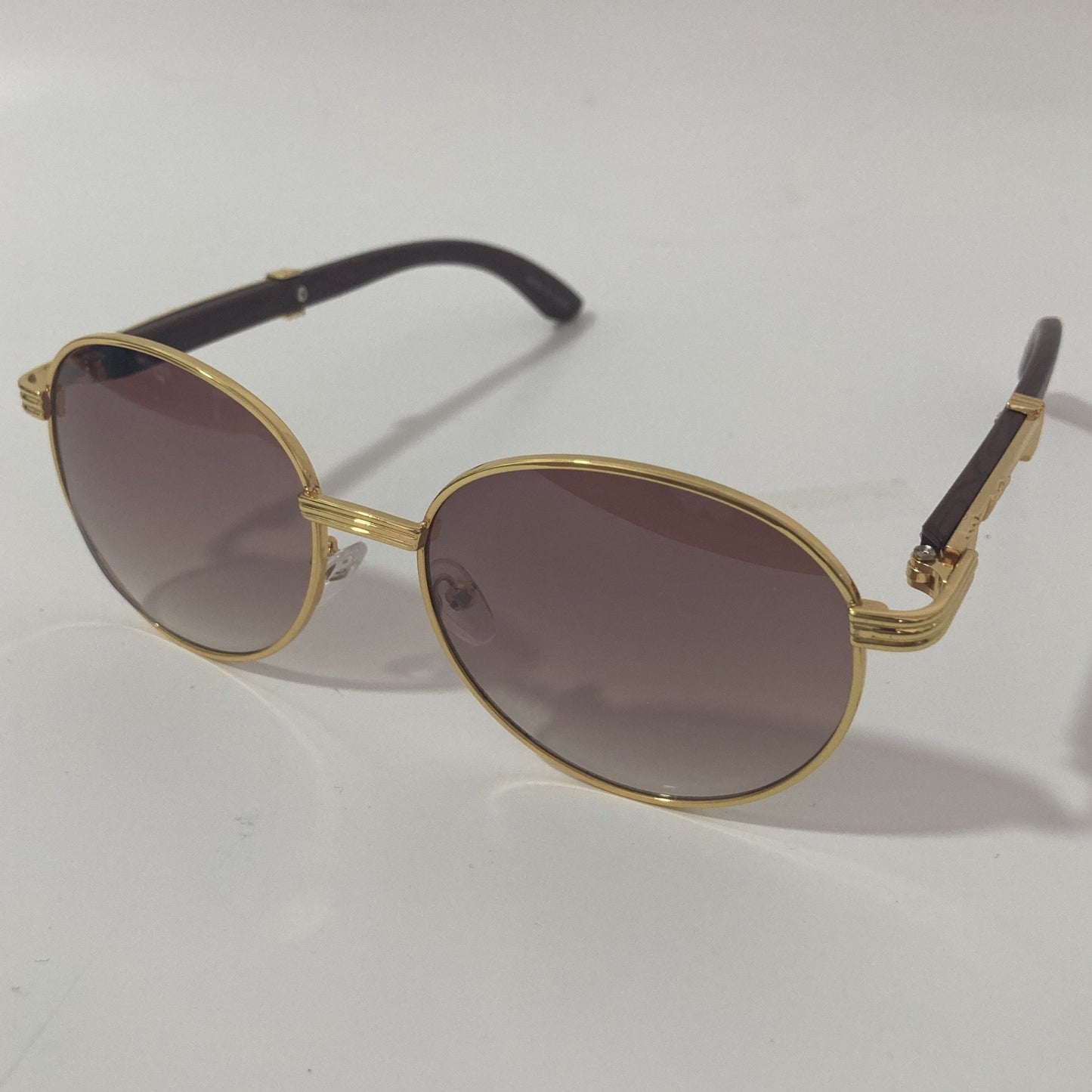 womens and mens gold and brown round sunglasses