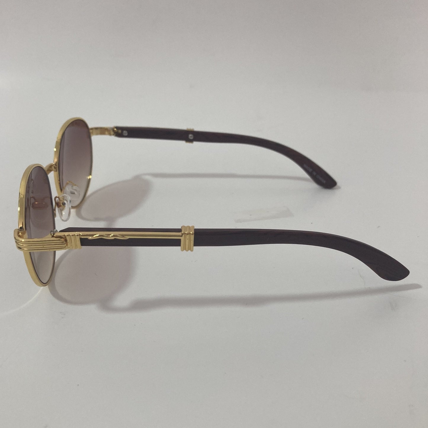 womens and mens gold and brown round sunglasses