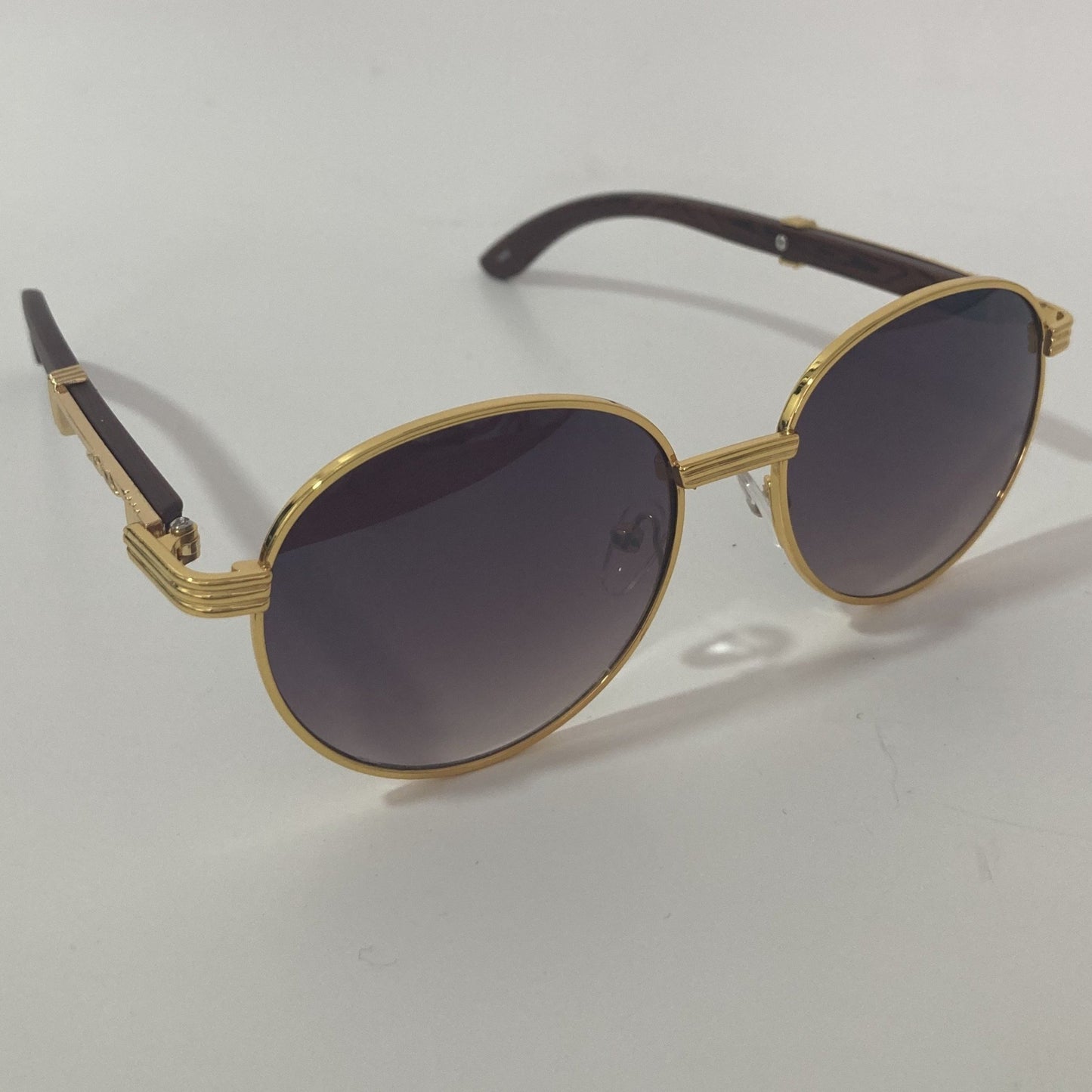 womens and mens gold and black round sunglasses