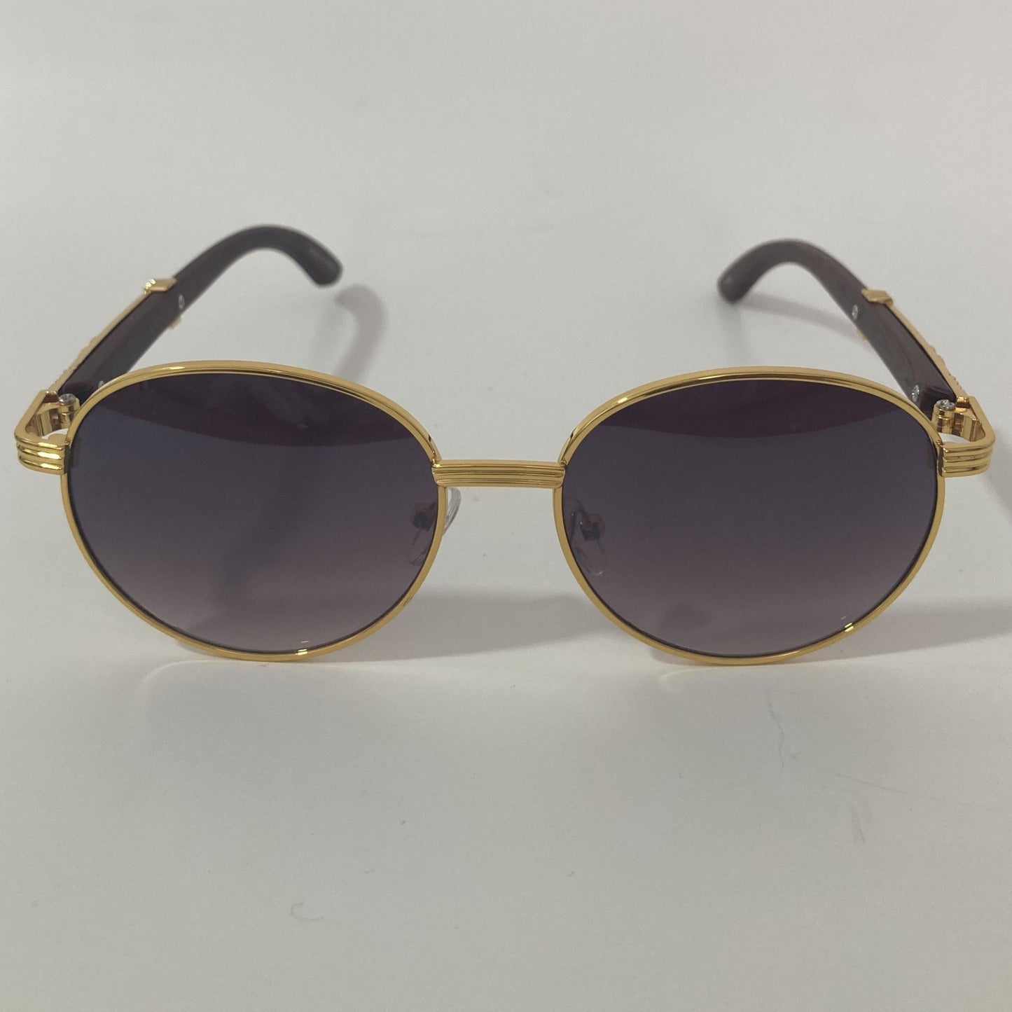 womens and mens gold and black round sunglasses