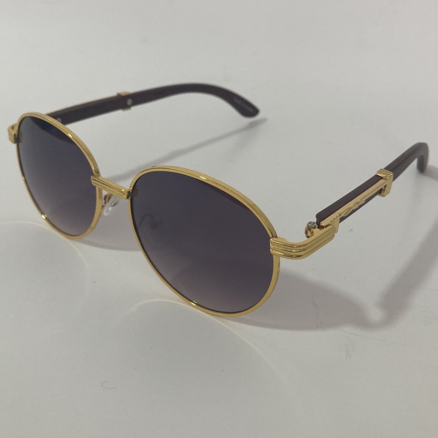 womens and mens gold and black round sunglasses