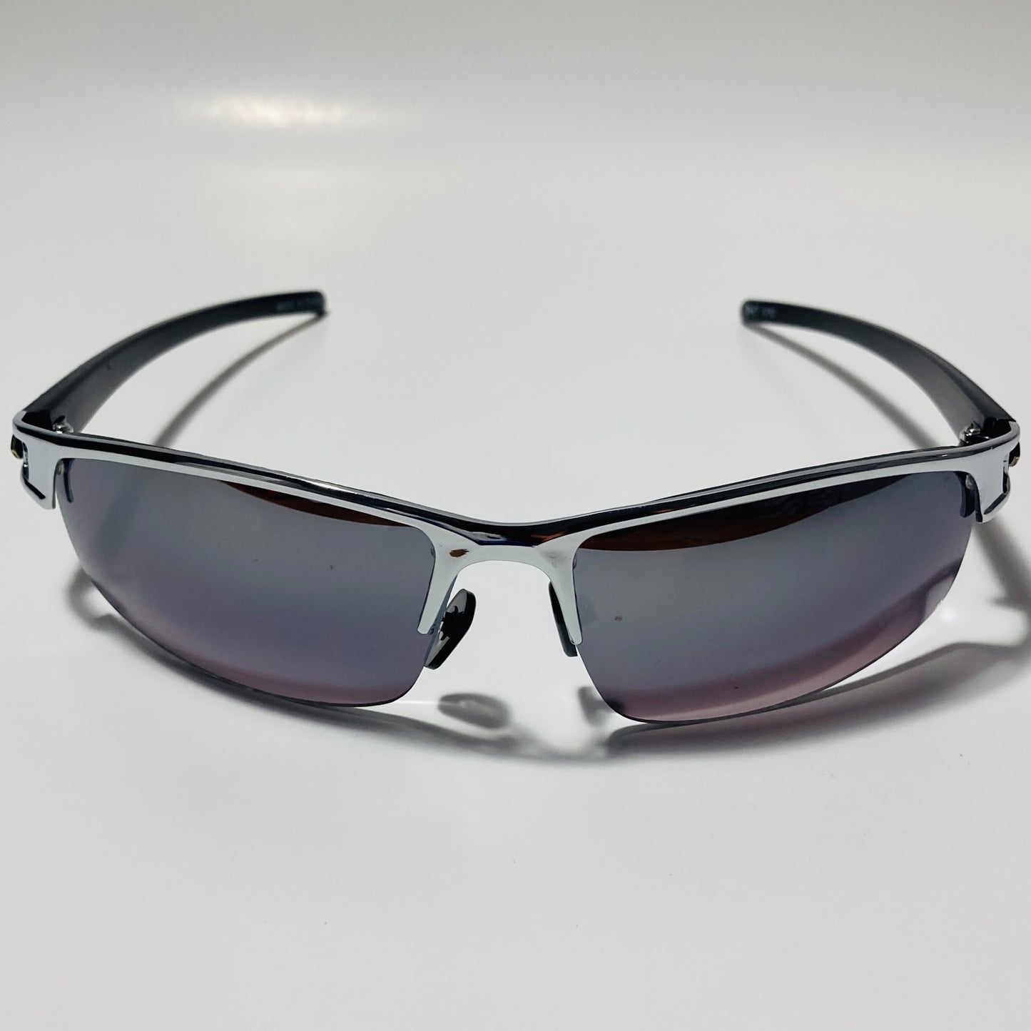 womens and mens silver wrap around sunglasses with black lenses