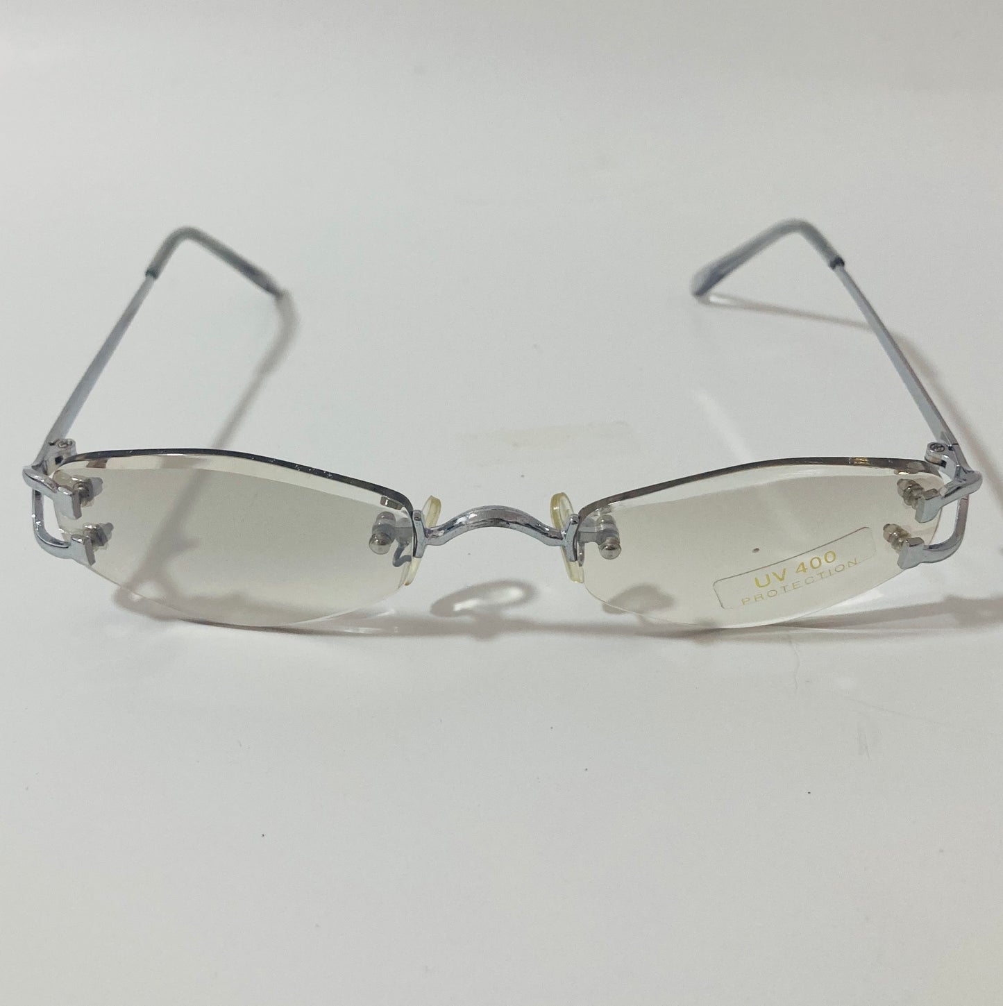 mens and womens silver and gray small rimless sunglasses