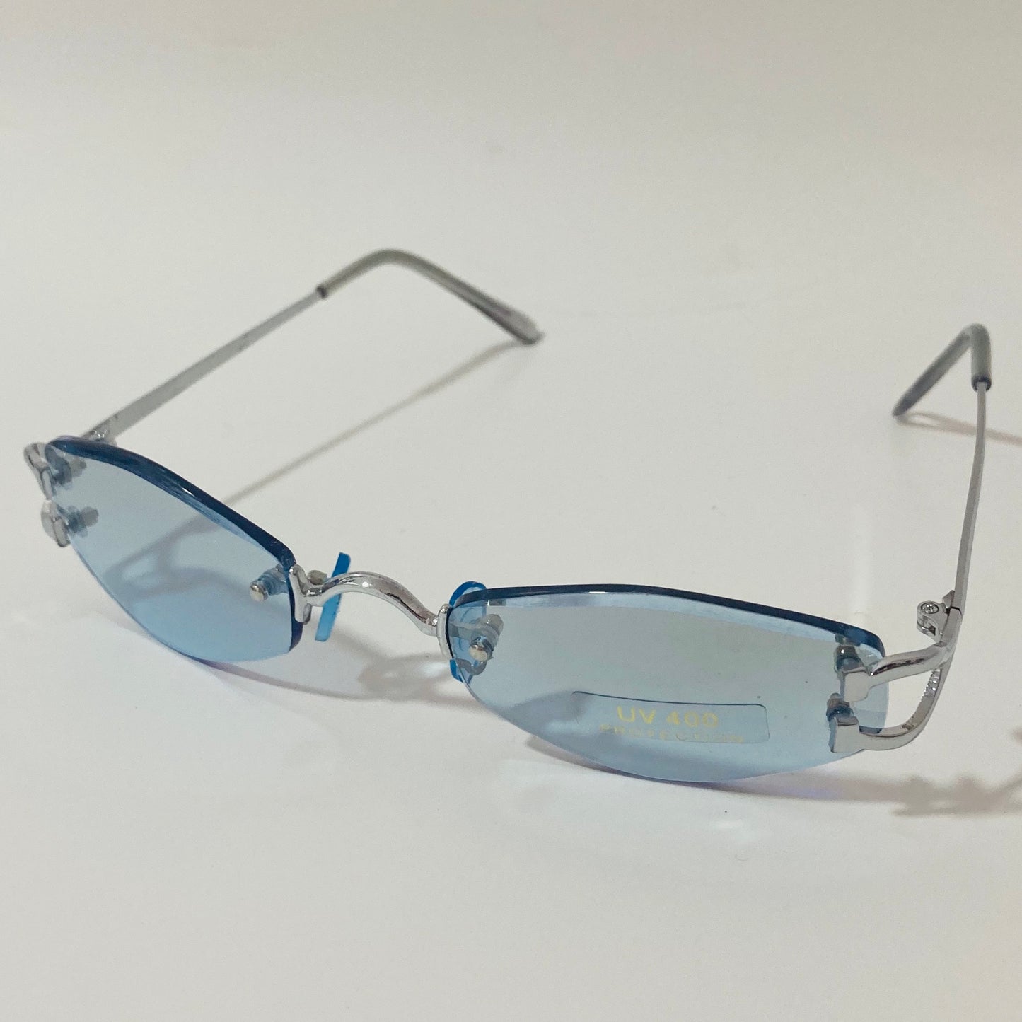 mens and womens silver and blue small rimless sunglasses