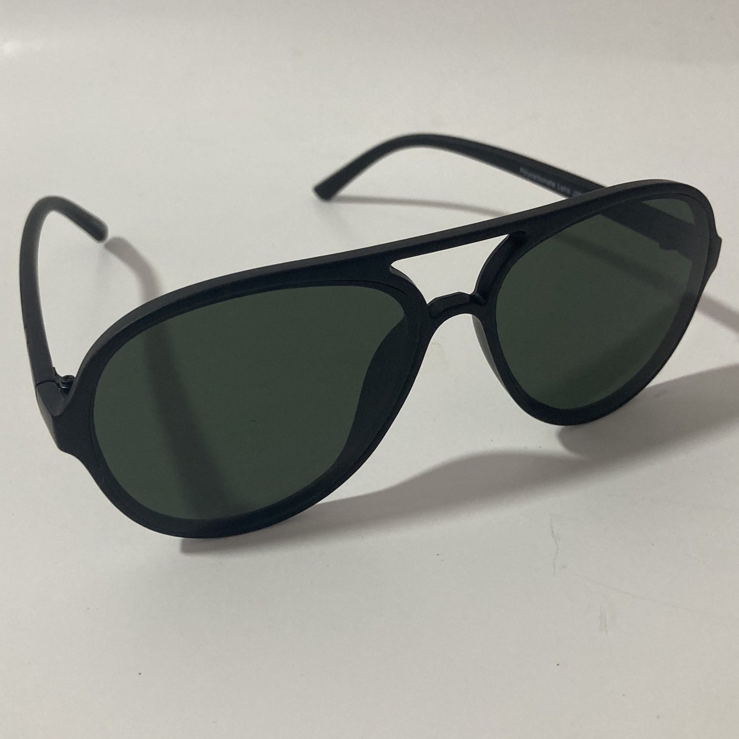 mens and womens black aviator sunglasses with green lenses