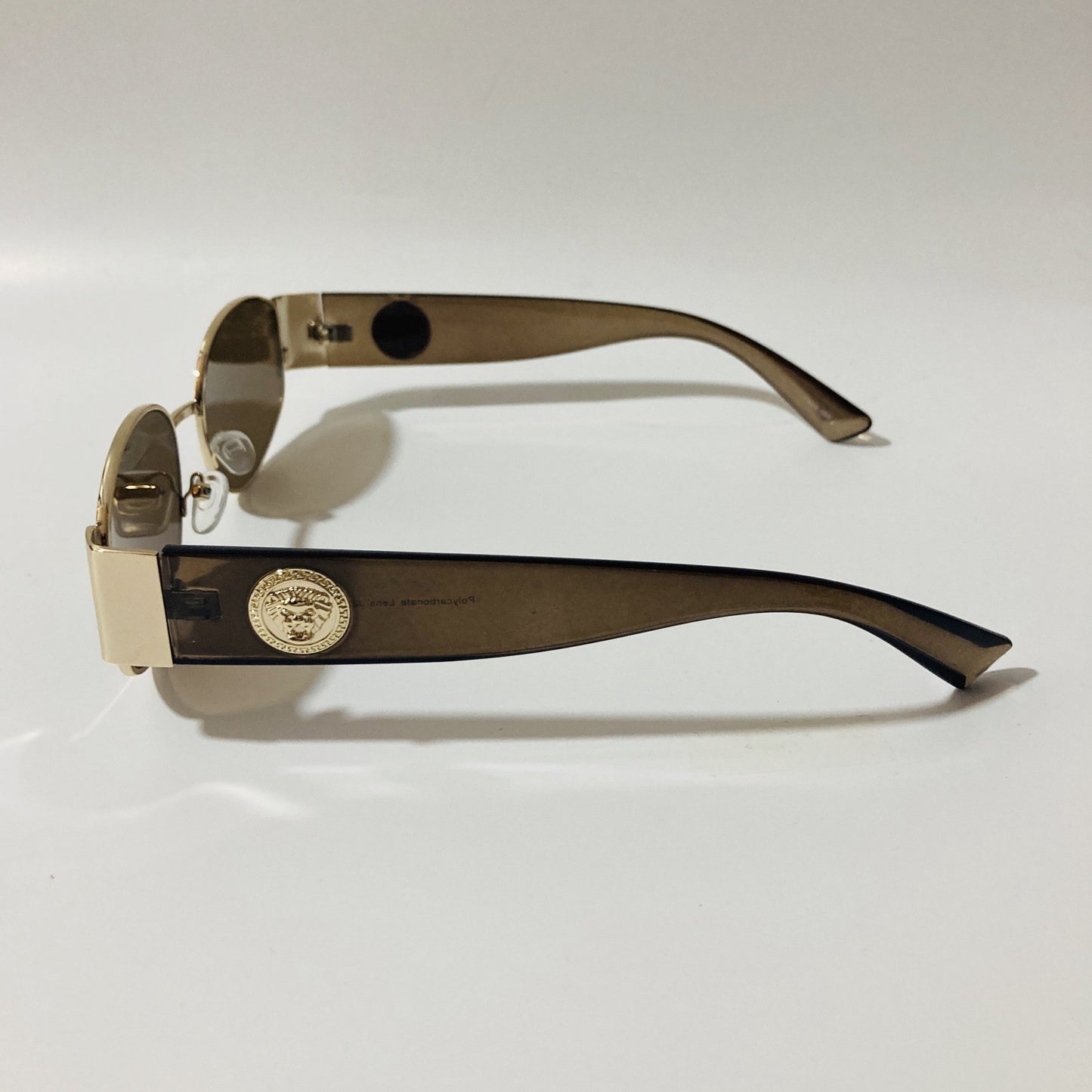 mens and womens brown and gold round sunglasses
