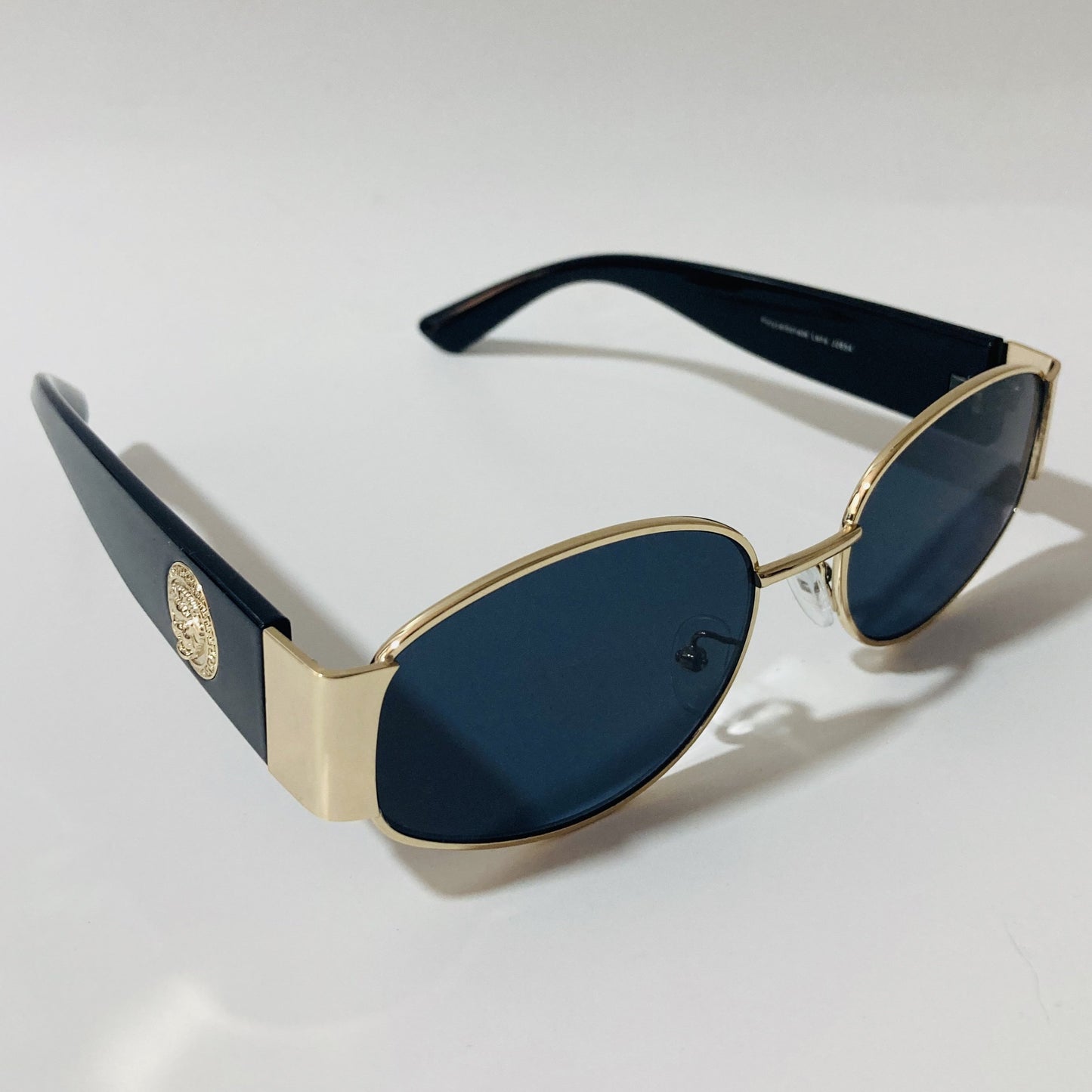 mens and womens black and gold round sunglasses