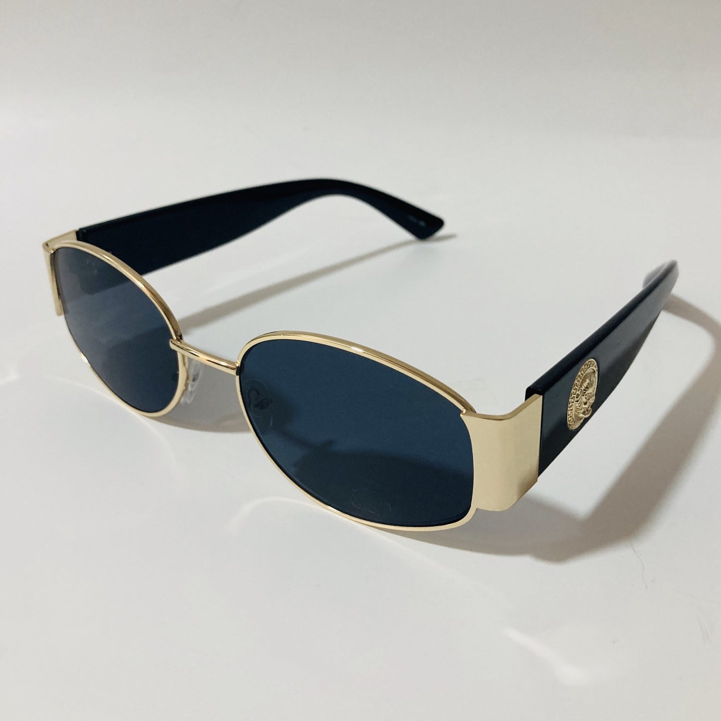 mens and womens black and gold round sunglasses