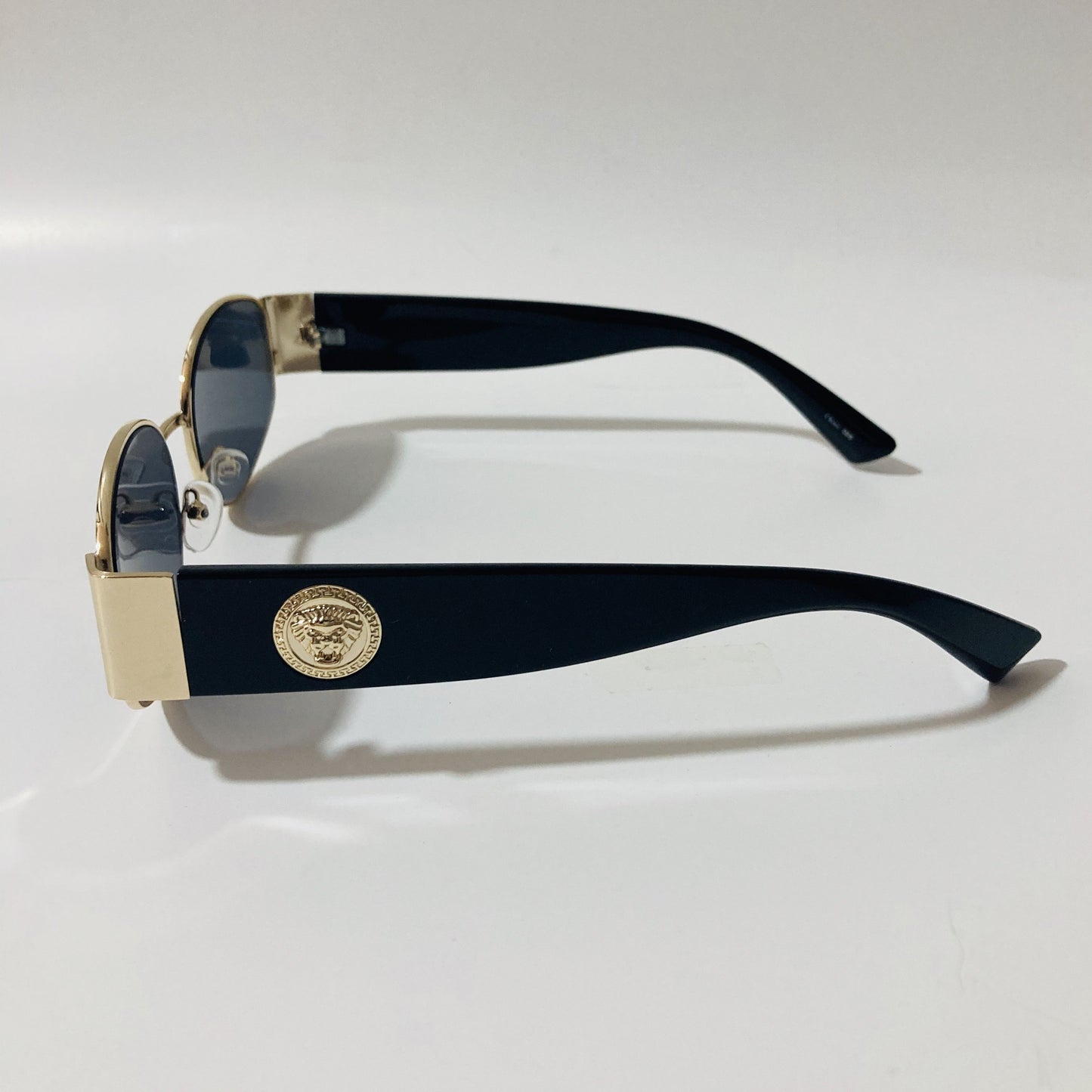 mens and womens black and gold round sunglasses