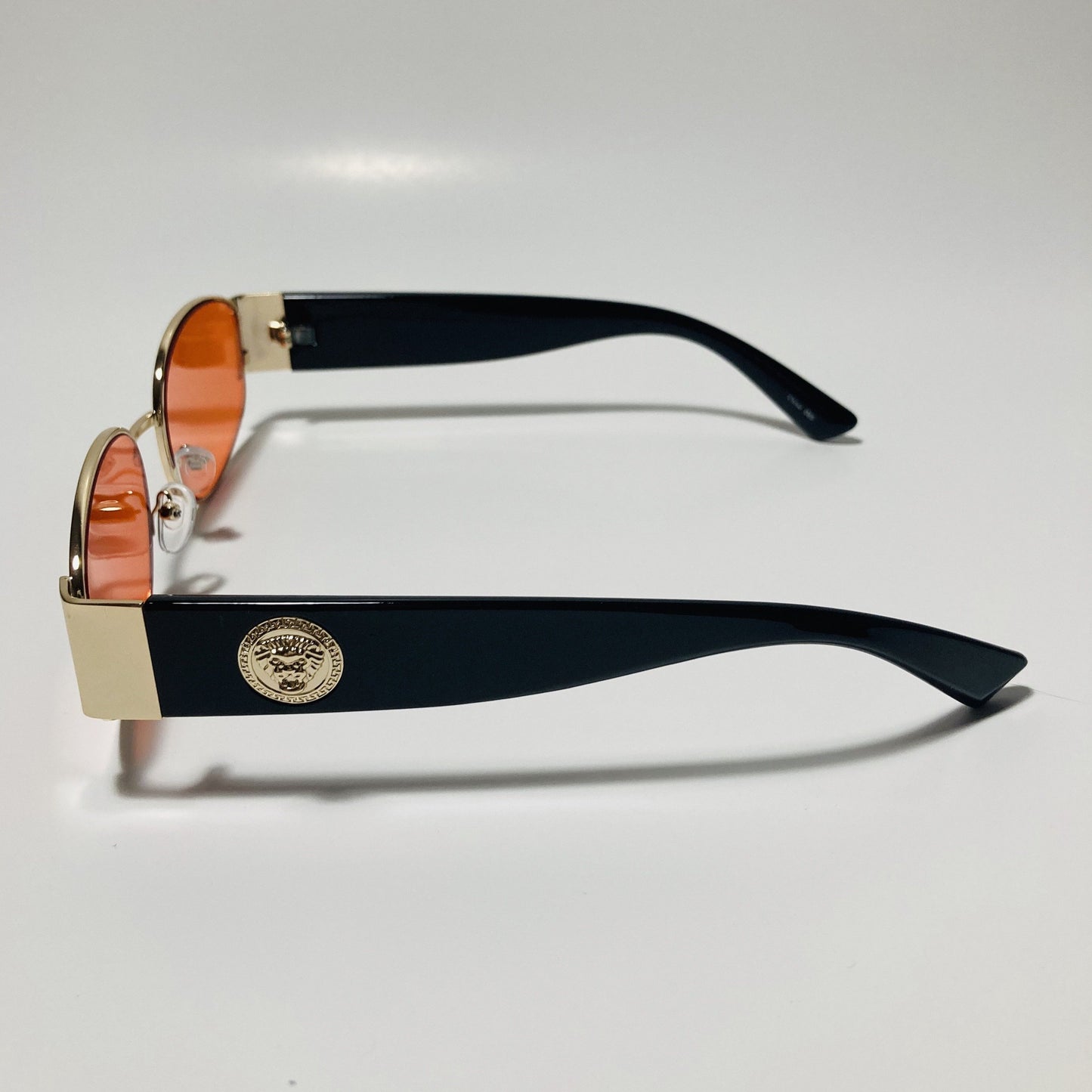 mens and womens black red and gold round sunglasses