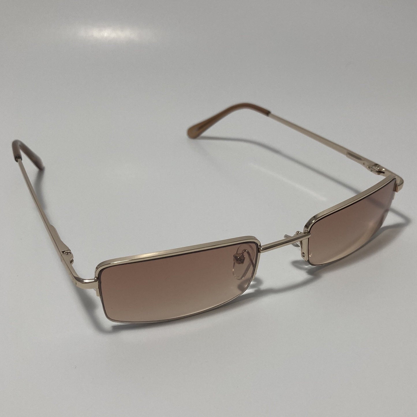 womens and mens brown and gold metal square sunglasses