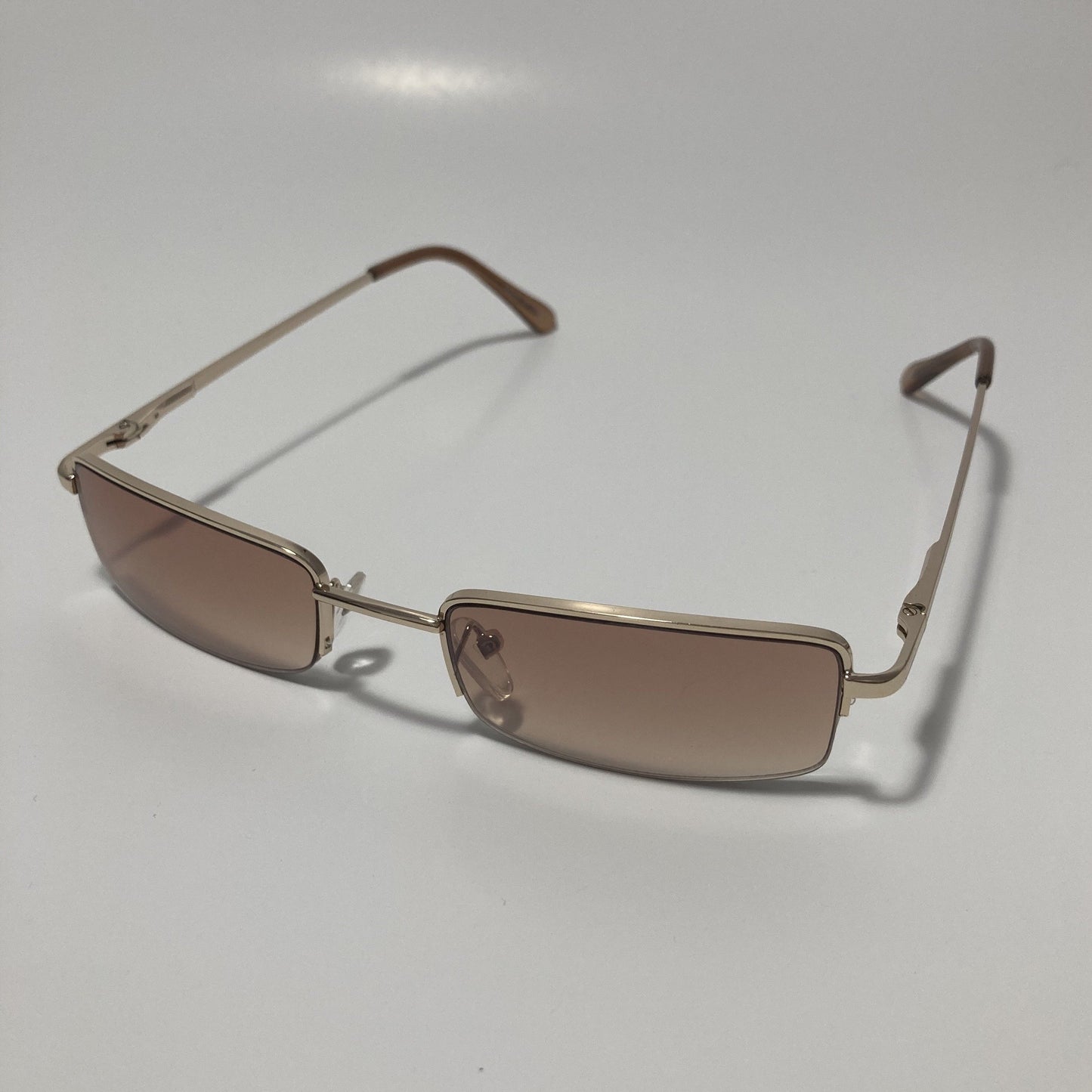 womens and mens brown and gold metal square sunglasses