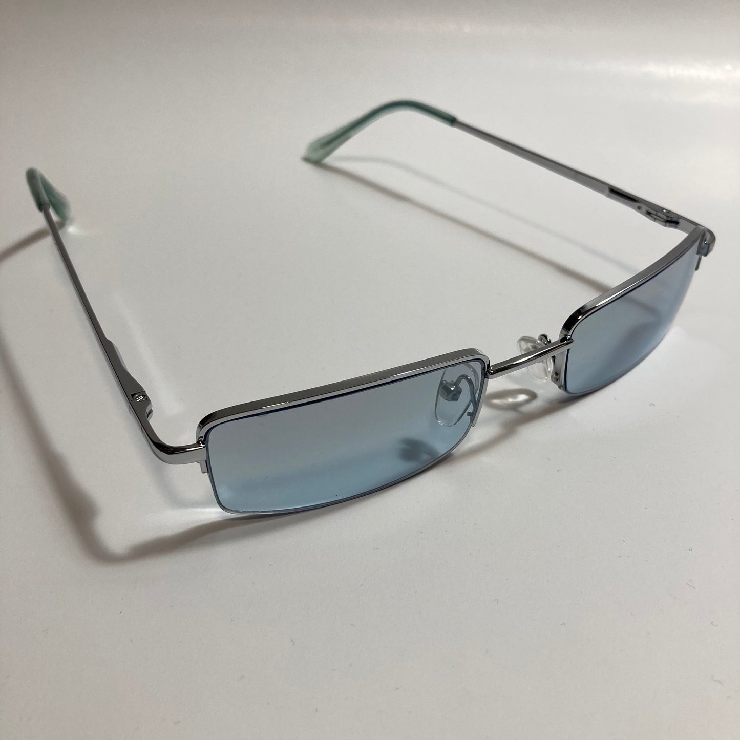 womens and mens blue and silver metal square sunglasses