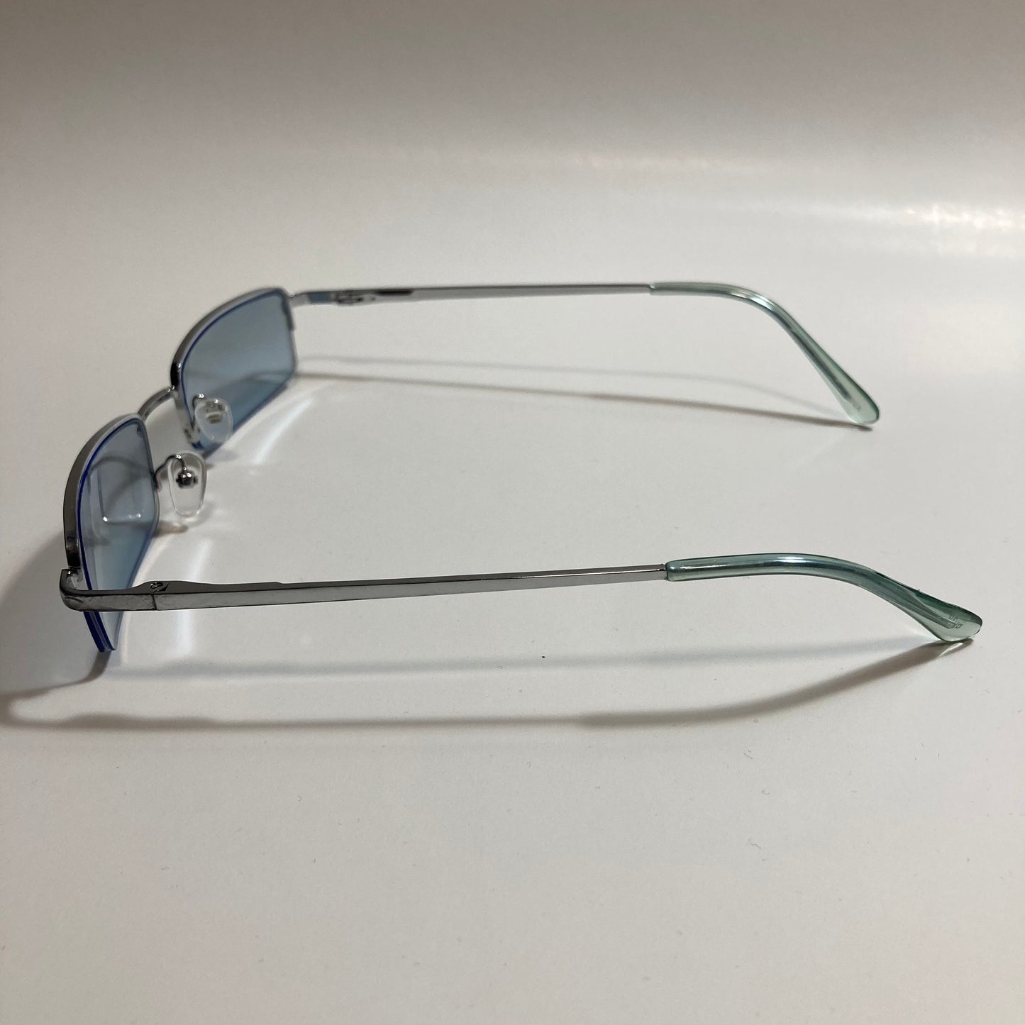 womens and mens blue and silver metal square sunglasses