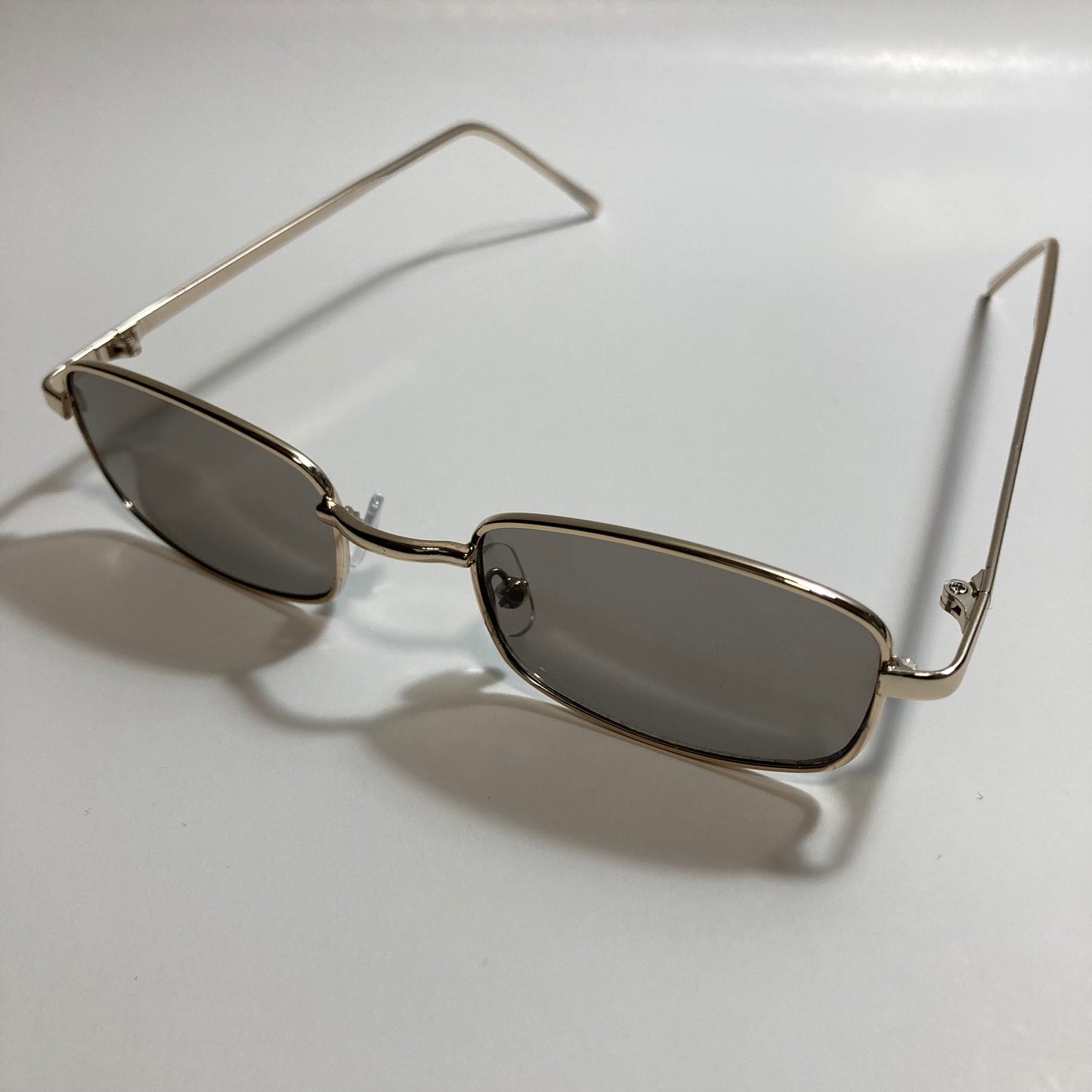 mens and womens gold and black square sunglasses