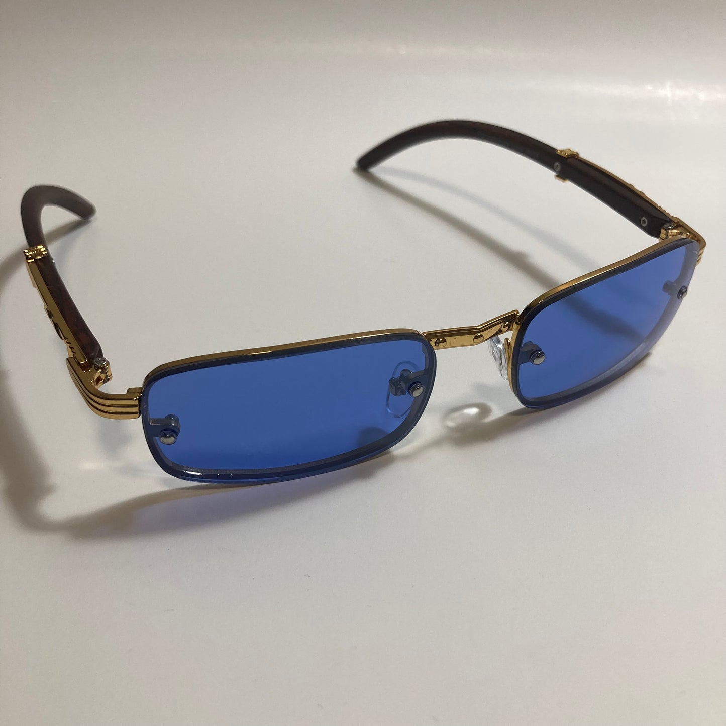 mens and womens blue and gold square sunglasses