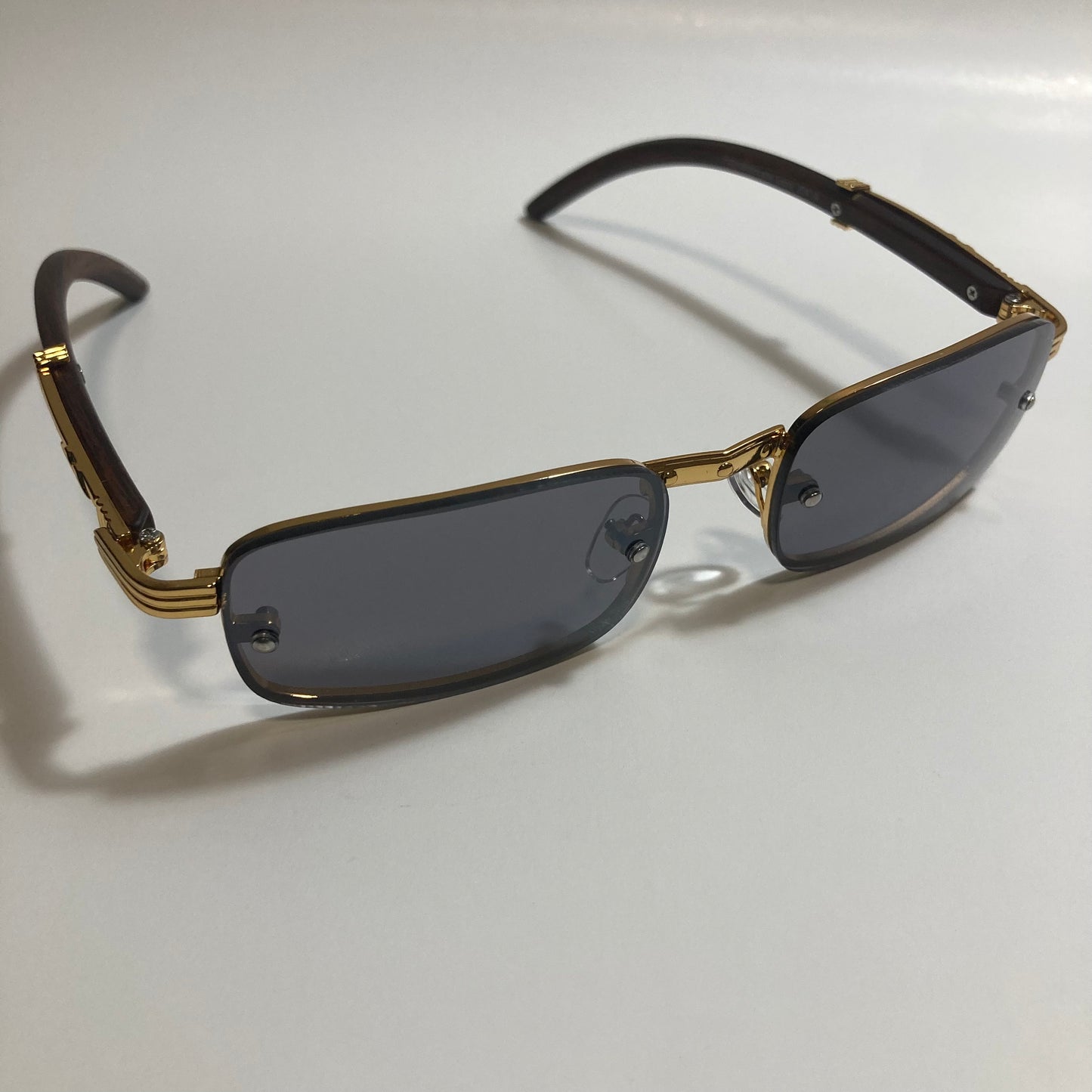 mens and womens black and gold square sunglasses