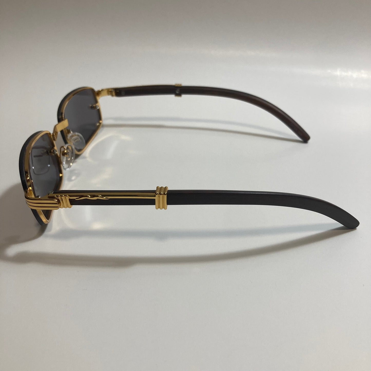 mens and womens black and gold square sunglasses