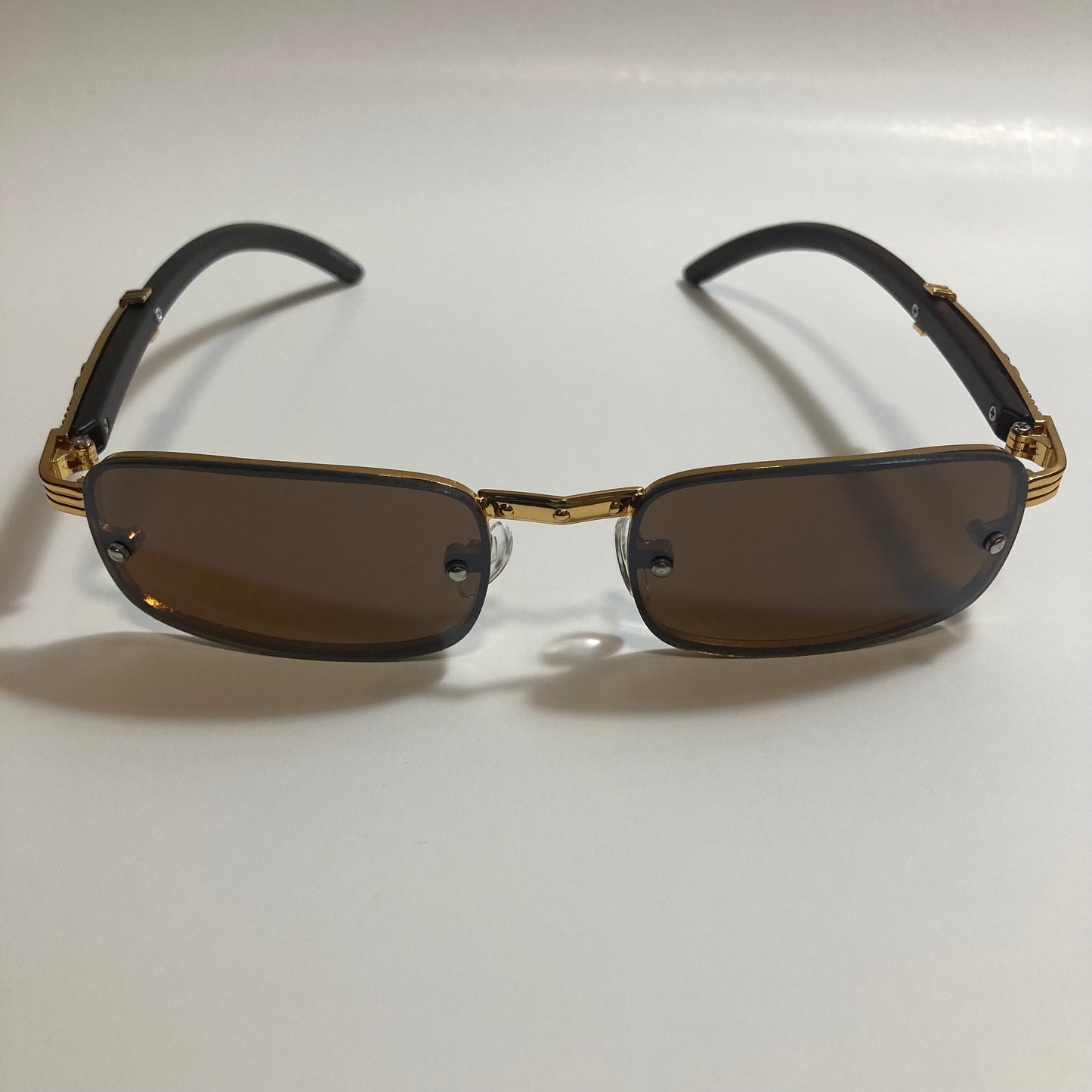 mens and womens brown and gold square sunglasses