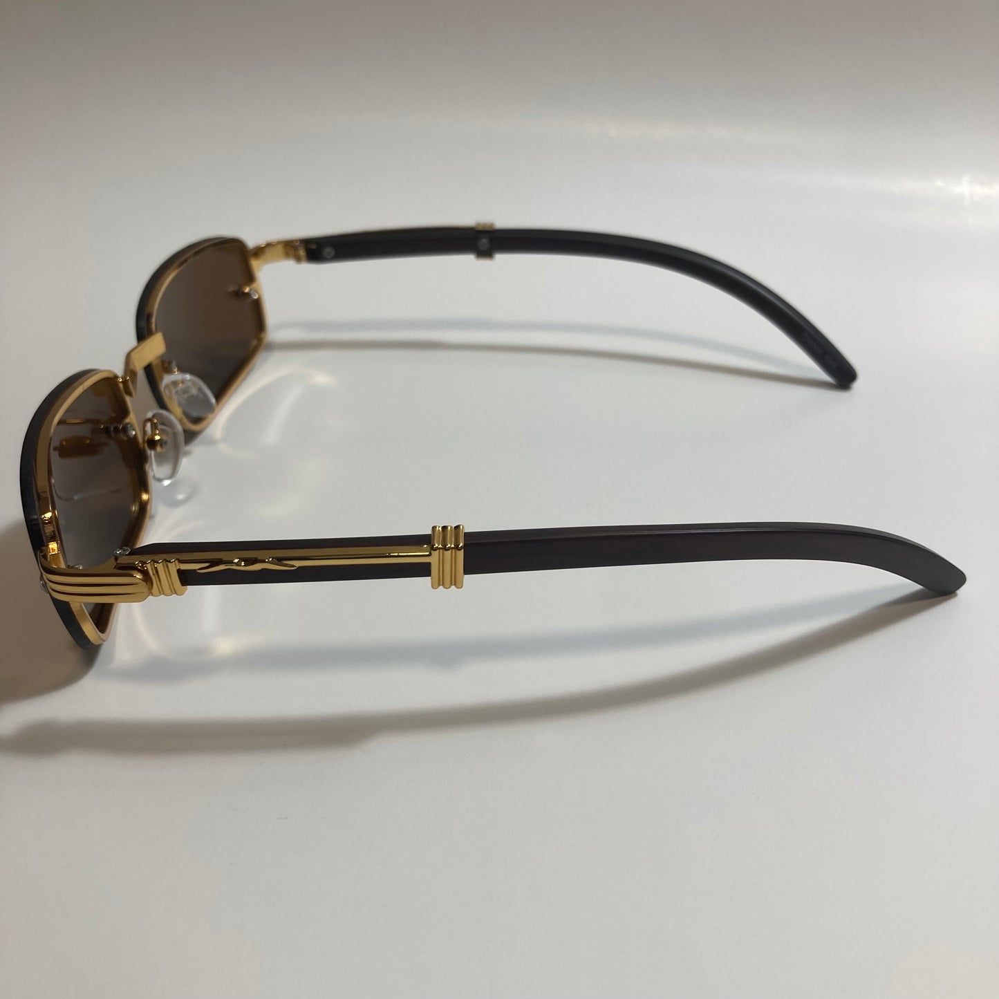 mens and womens brown and gold square sunglasses