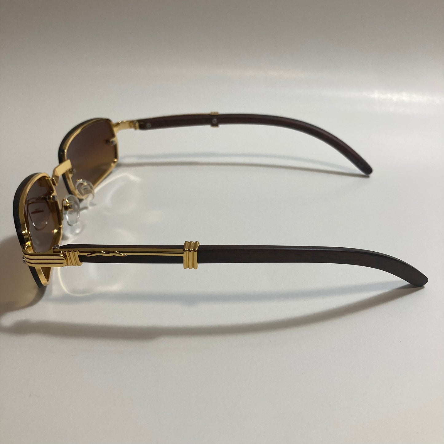 mens and womens brown and gold square sunglasses