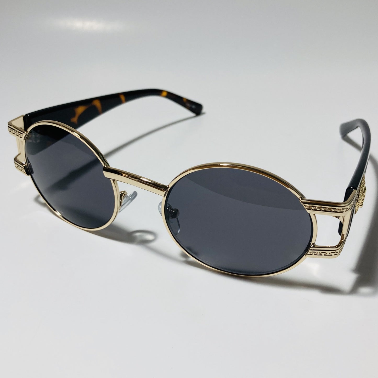 mens and womens black and gold round sunglasses