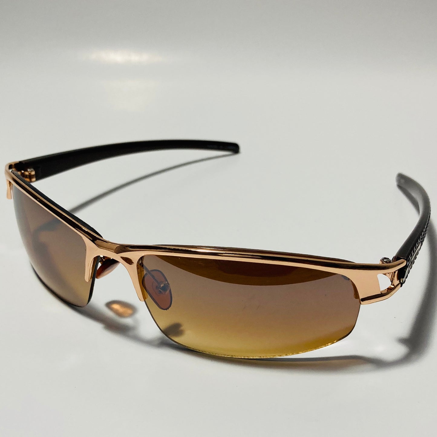 womens and mens gold wrap around sunglasses with brown lenses