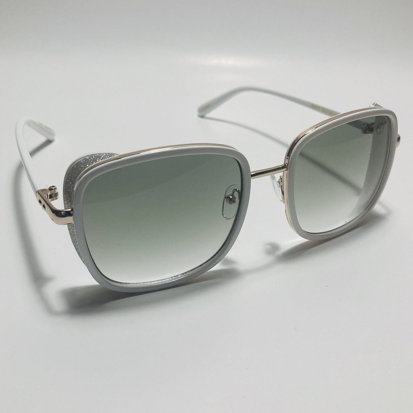 white and green elton john sunglasses