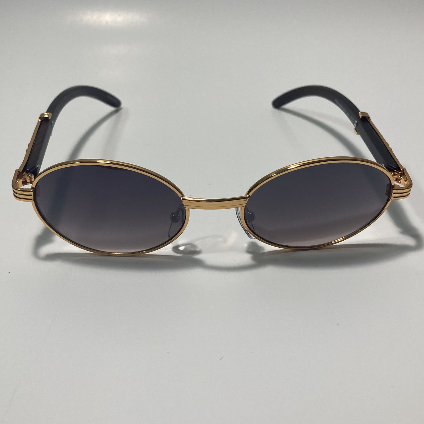 mens and womens gray and gold round sunglasses