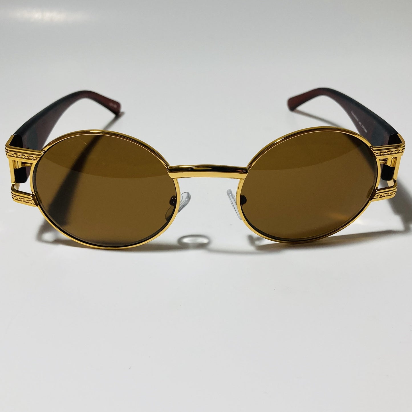 mens and womens brown and gold round sunglasses