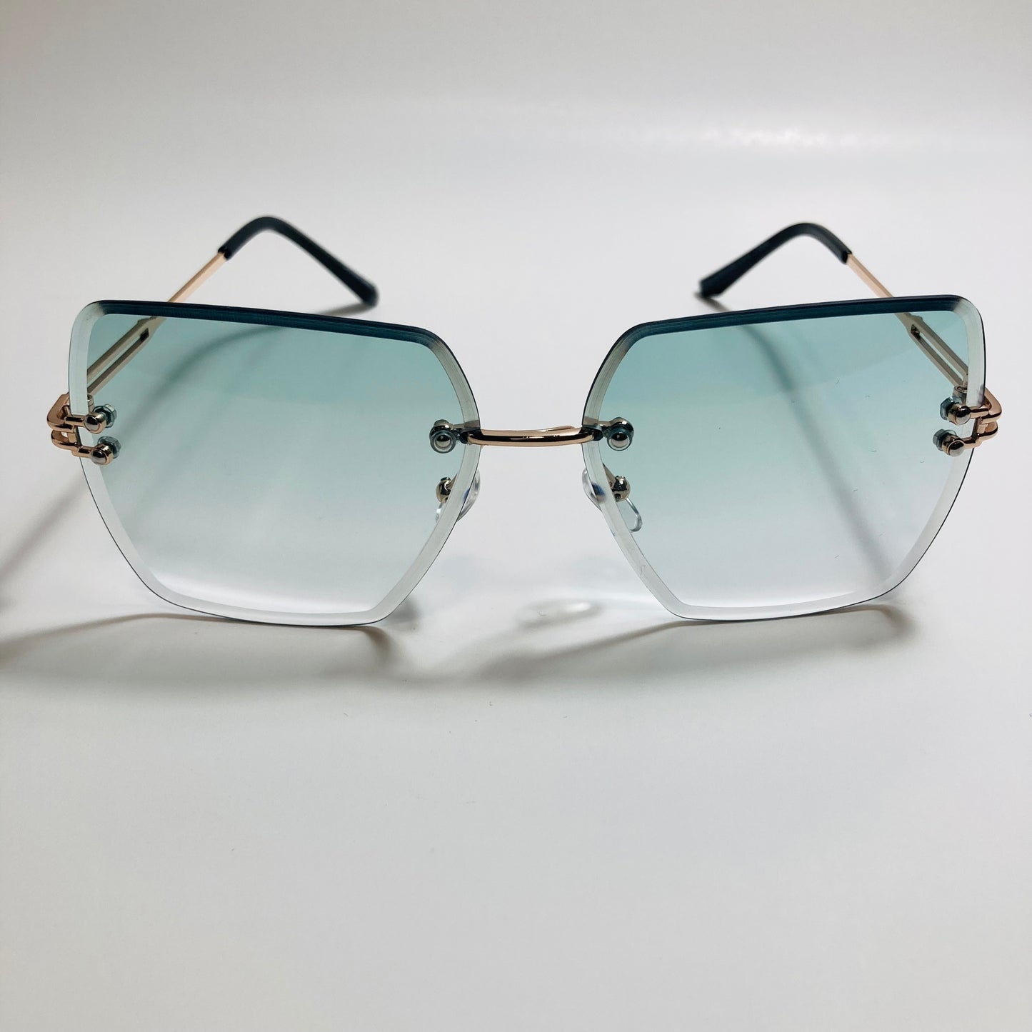 womens green and gold rimless oversize sunglasses