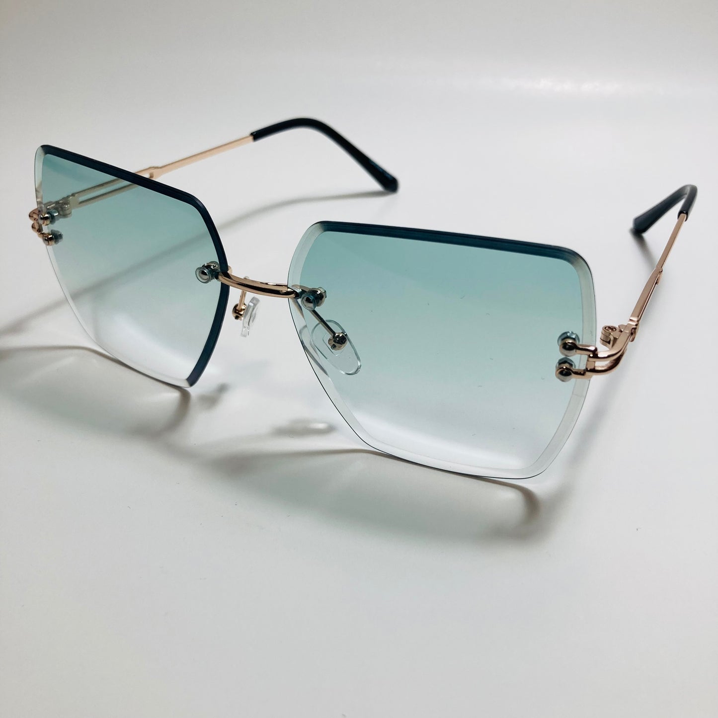 womens green and gold rimless oversize sunglasses