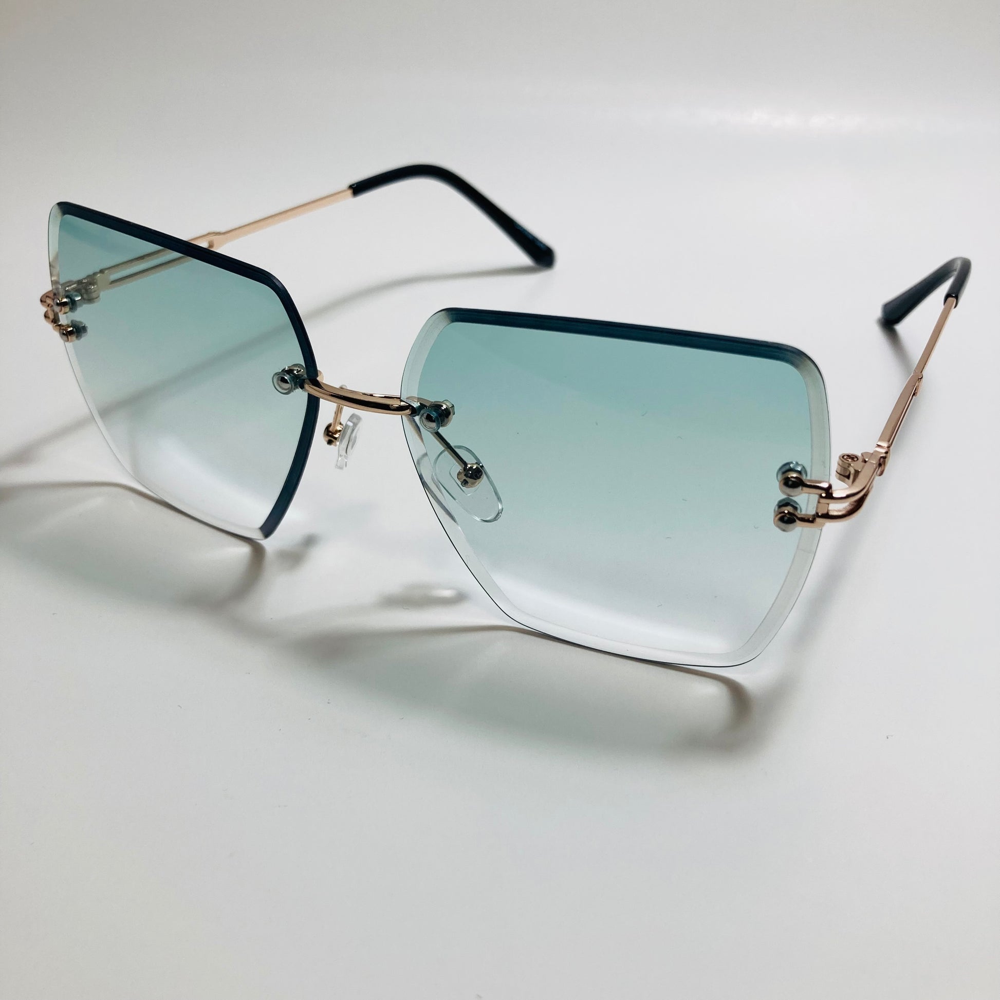 womens green and gold rimless oversize sunglasses