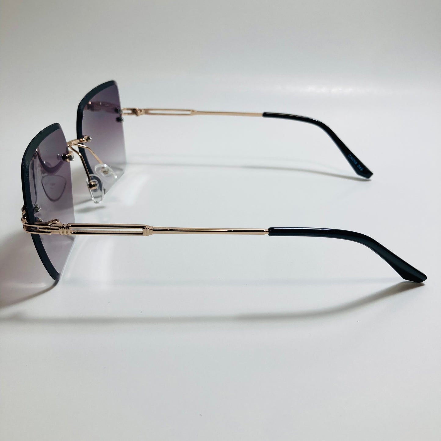 womens black and gold rimless oversize sunglasses