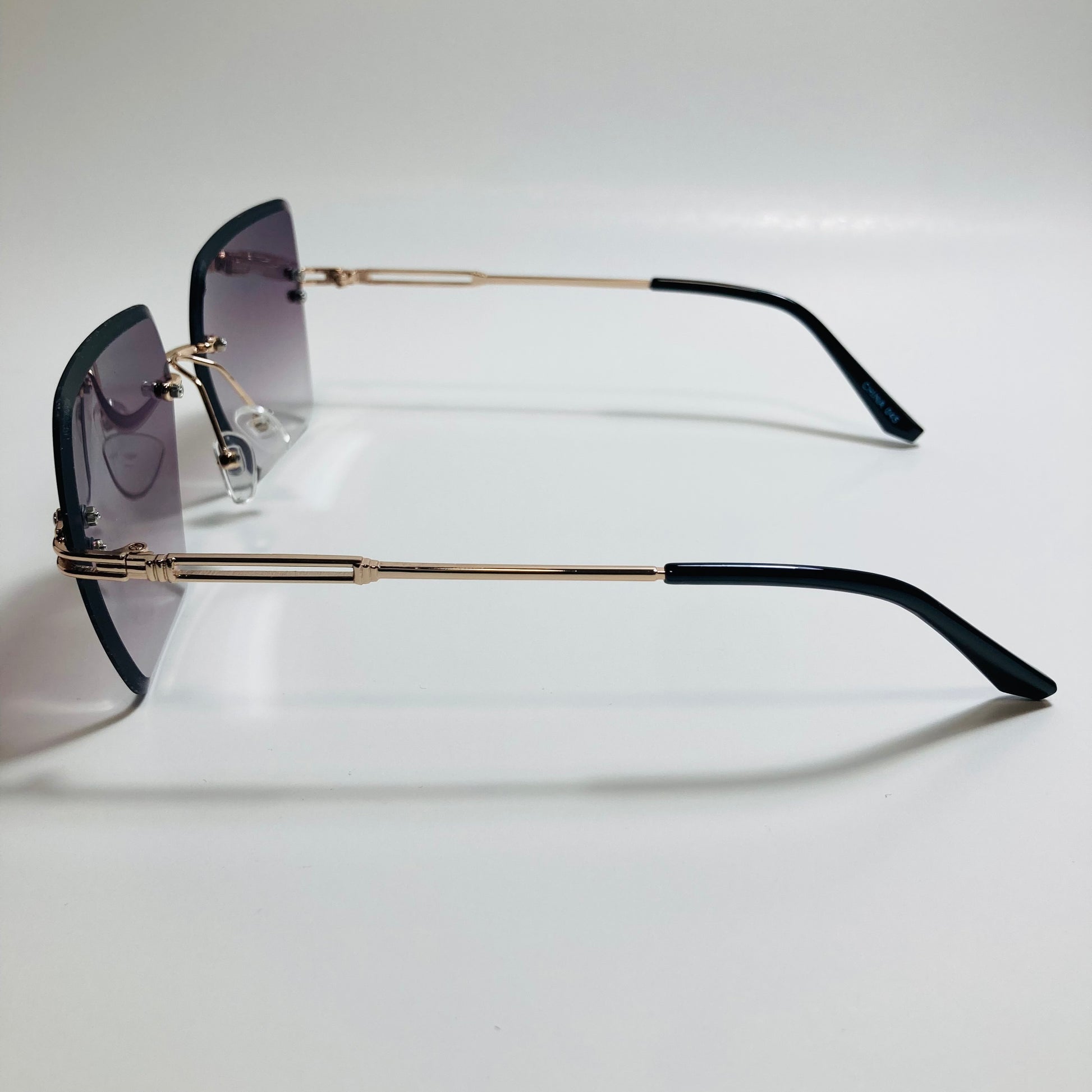 womens black and gold rimless oversize sunglasses