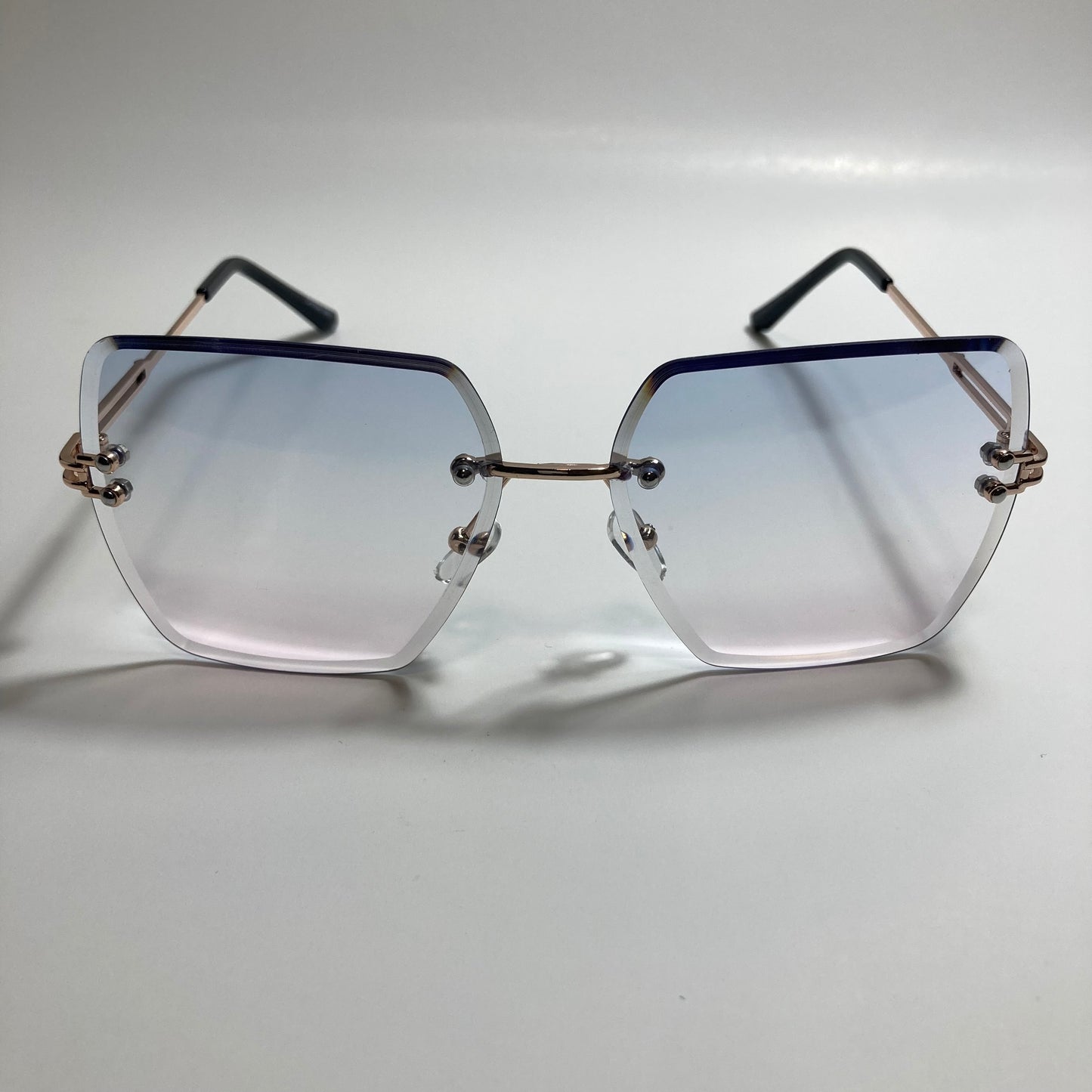 womens blue pink and gold rimless oversize sunglasses