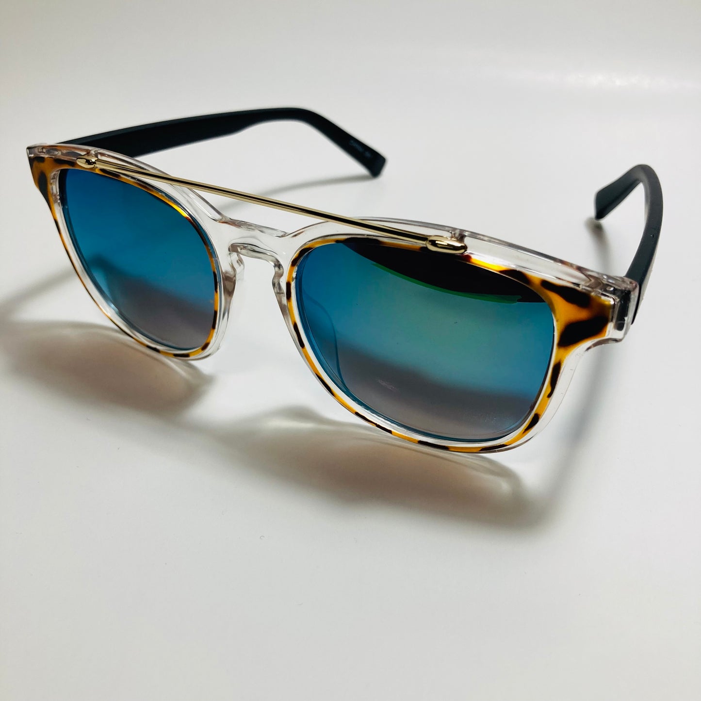 mens and womens clear black and blue mirrored round sunglasses with crossbar