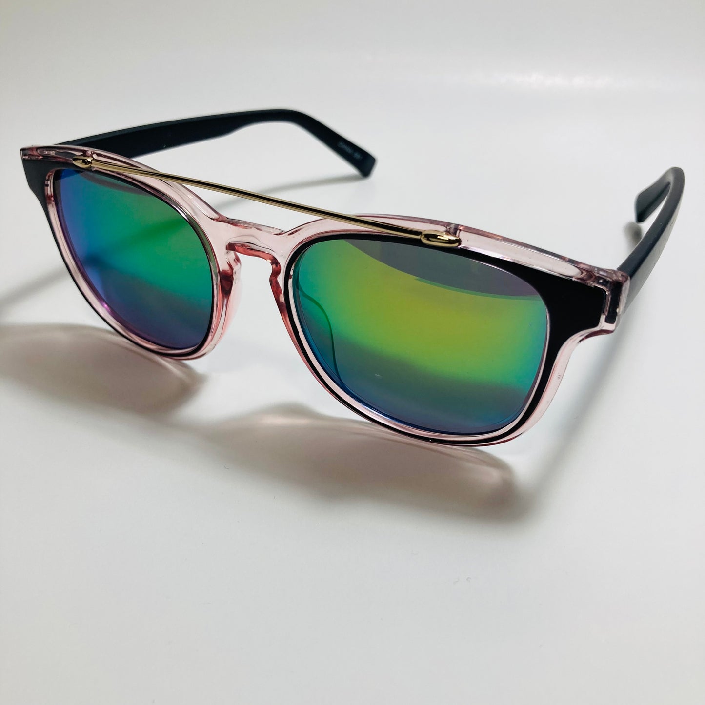 mens and womens pink black and green mirrored round sunglasses with crossbar
