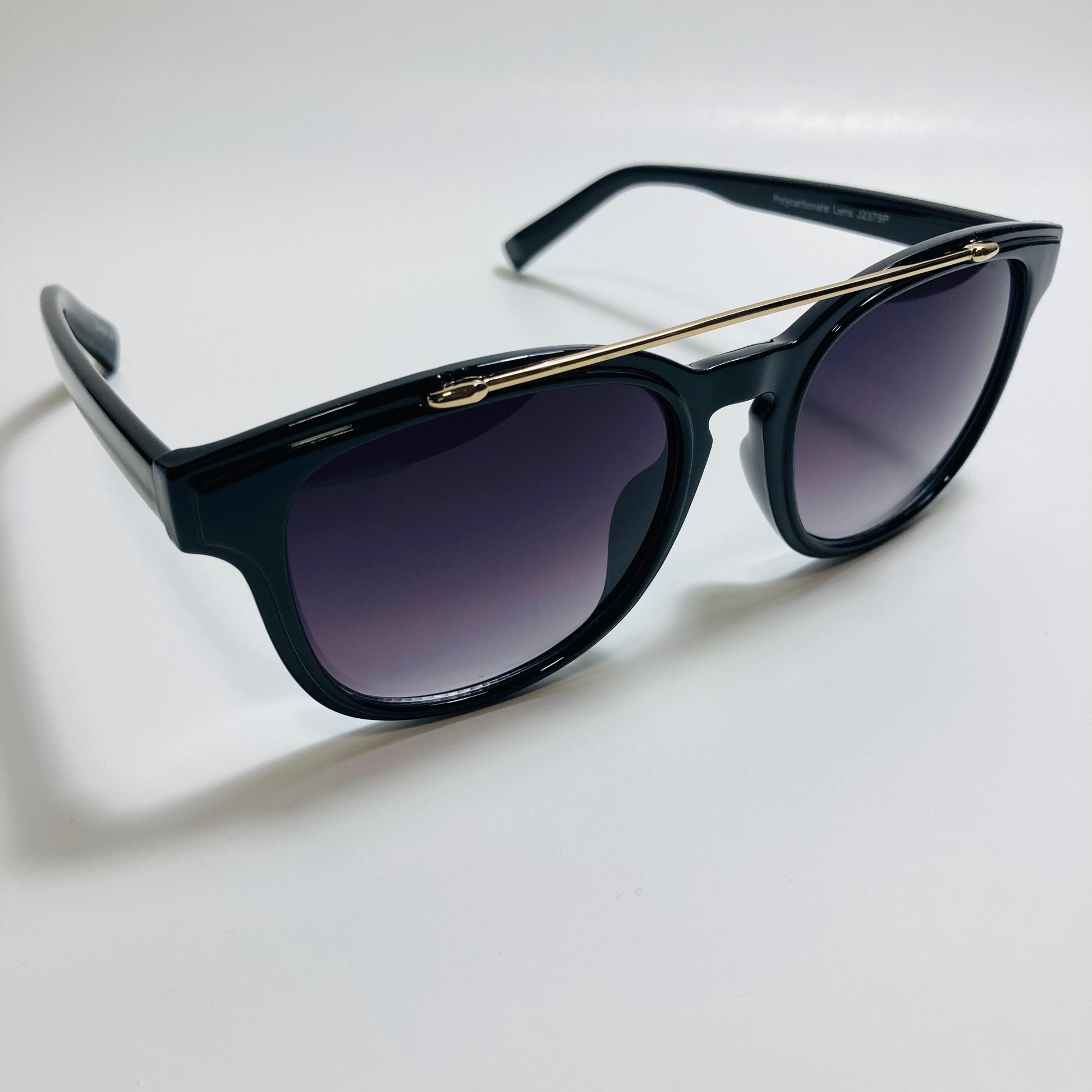 mens and womens black round sunglasses with crossbar