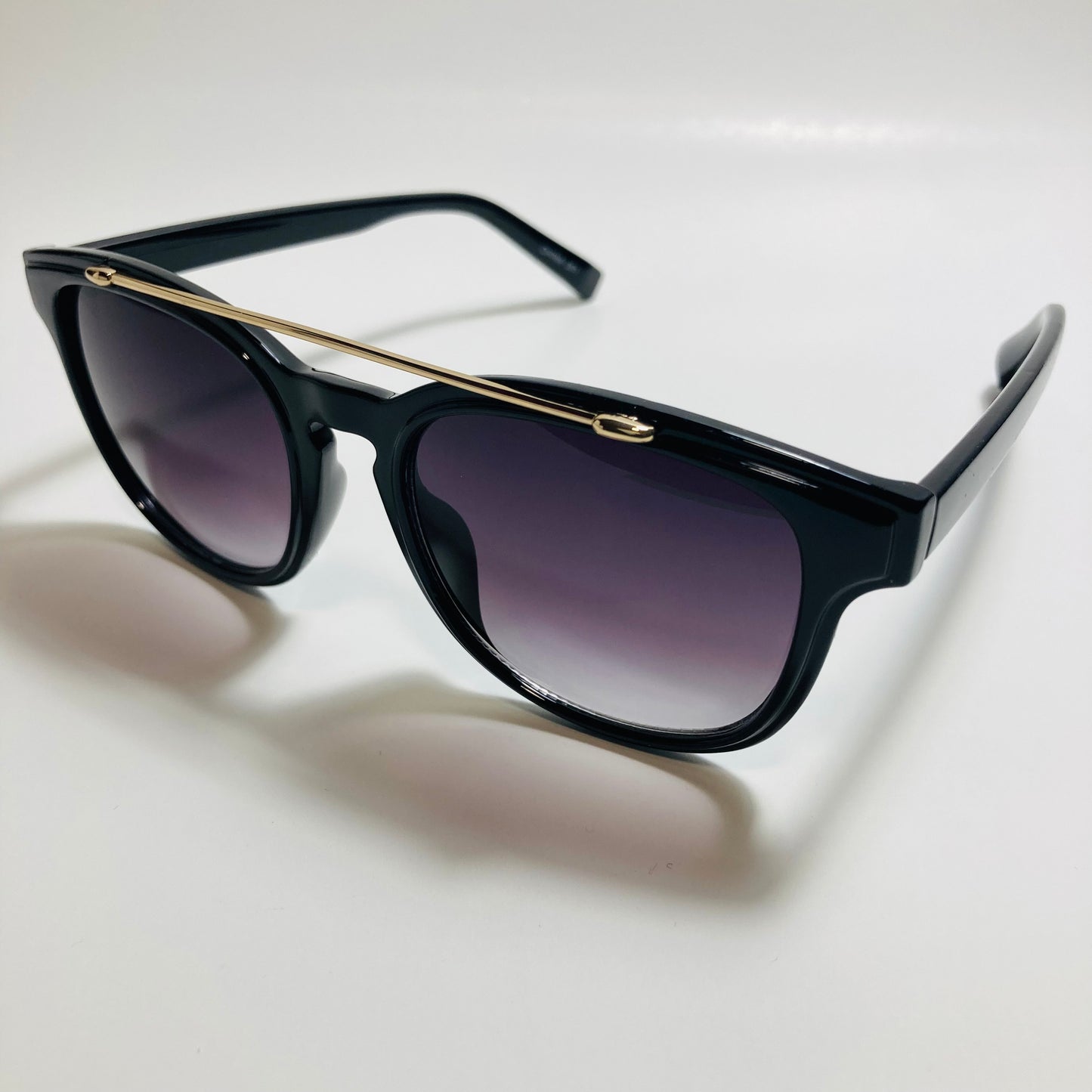 mens and womens black round sunglasses with crossbar