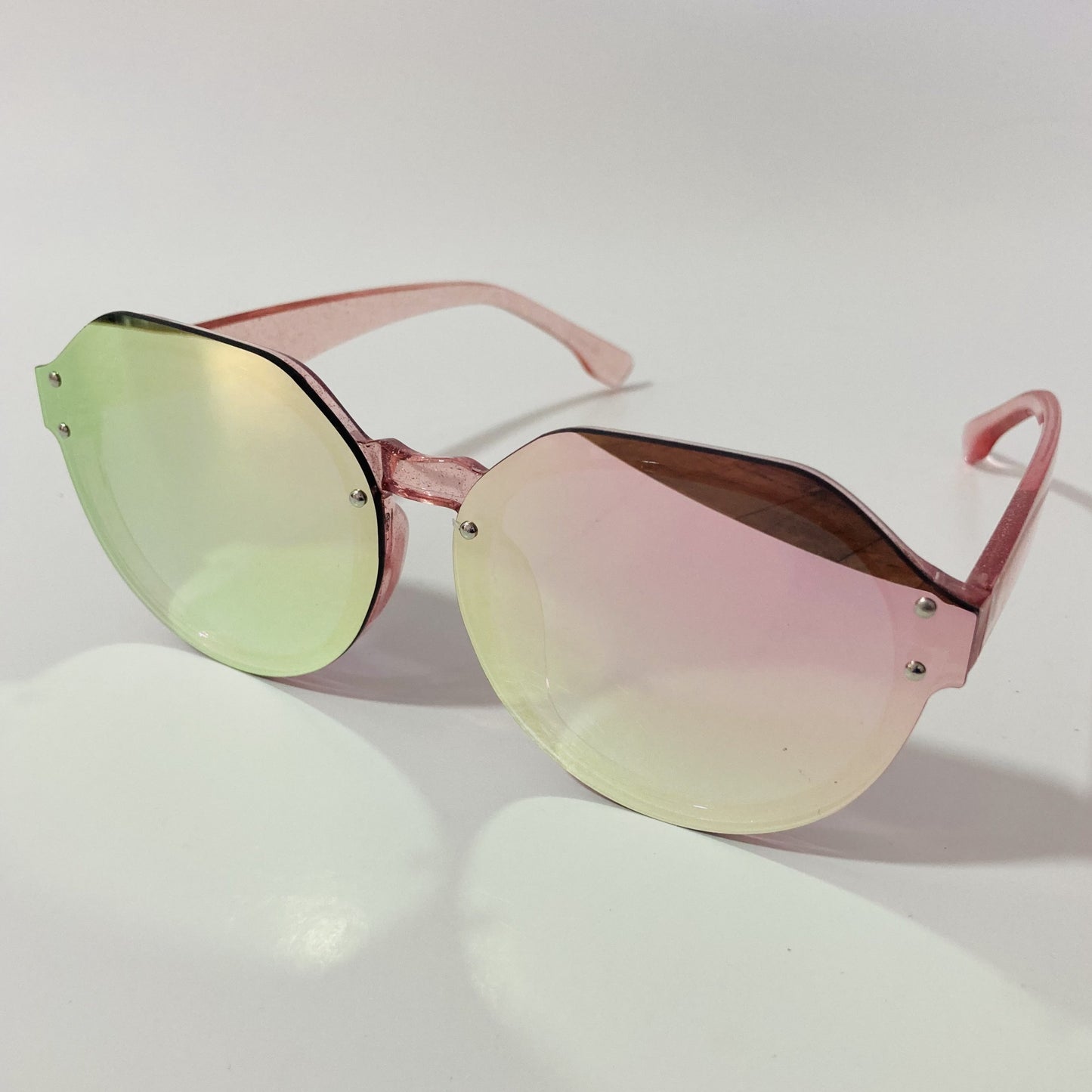 womens green and pink mirrored round glitter sunglasses