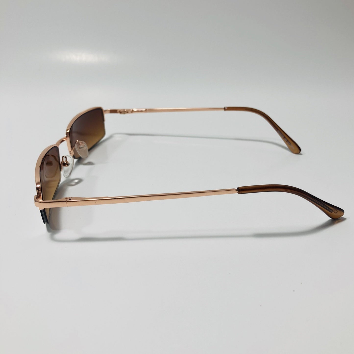 womens and mens brown and gold metal square sunglasses