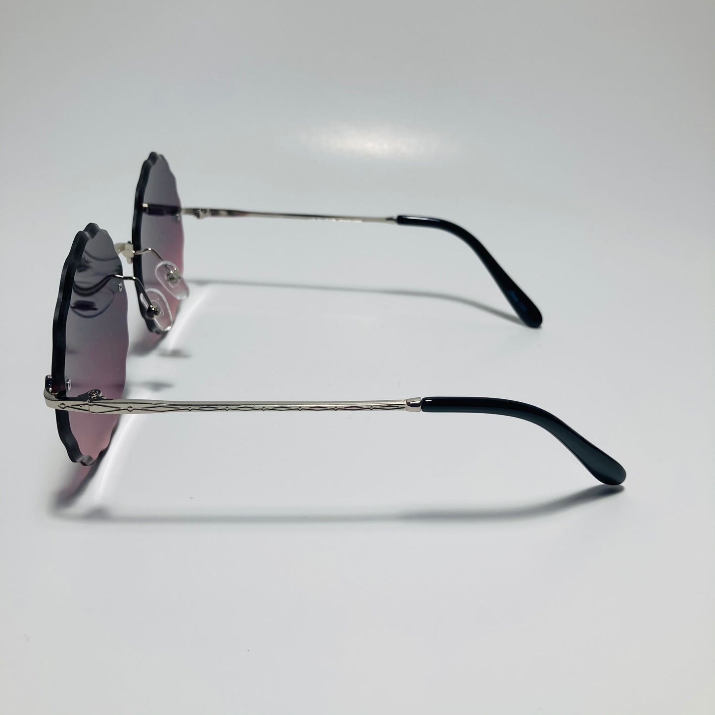 womens purple pink and silver rimless round sunglasses