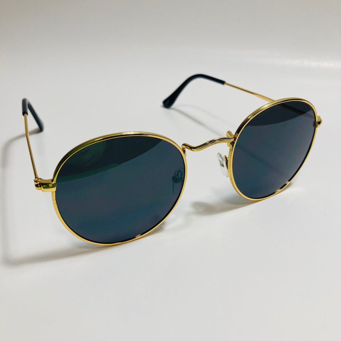 mens and womens round gold sunglasses with black lenses