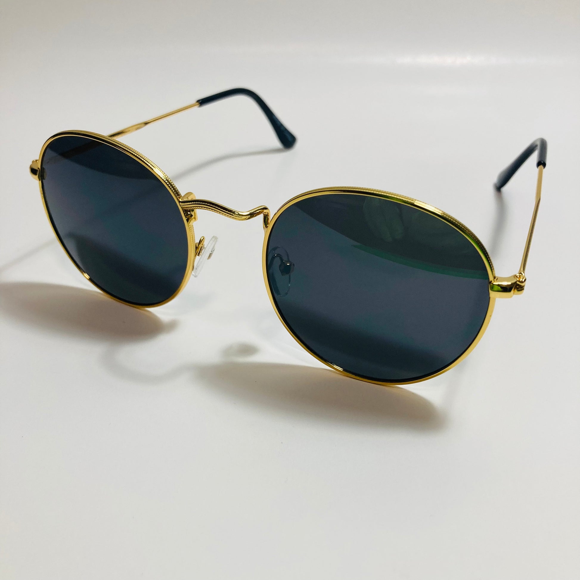 mens and womens round gold sunglasses with black lenses